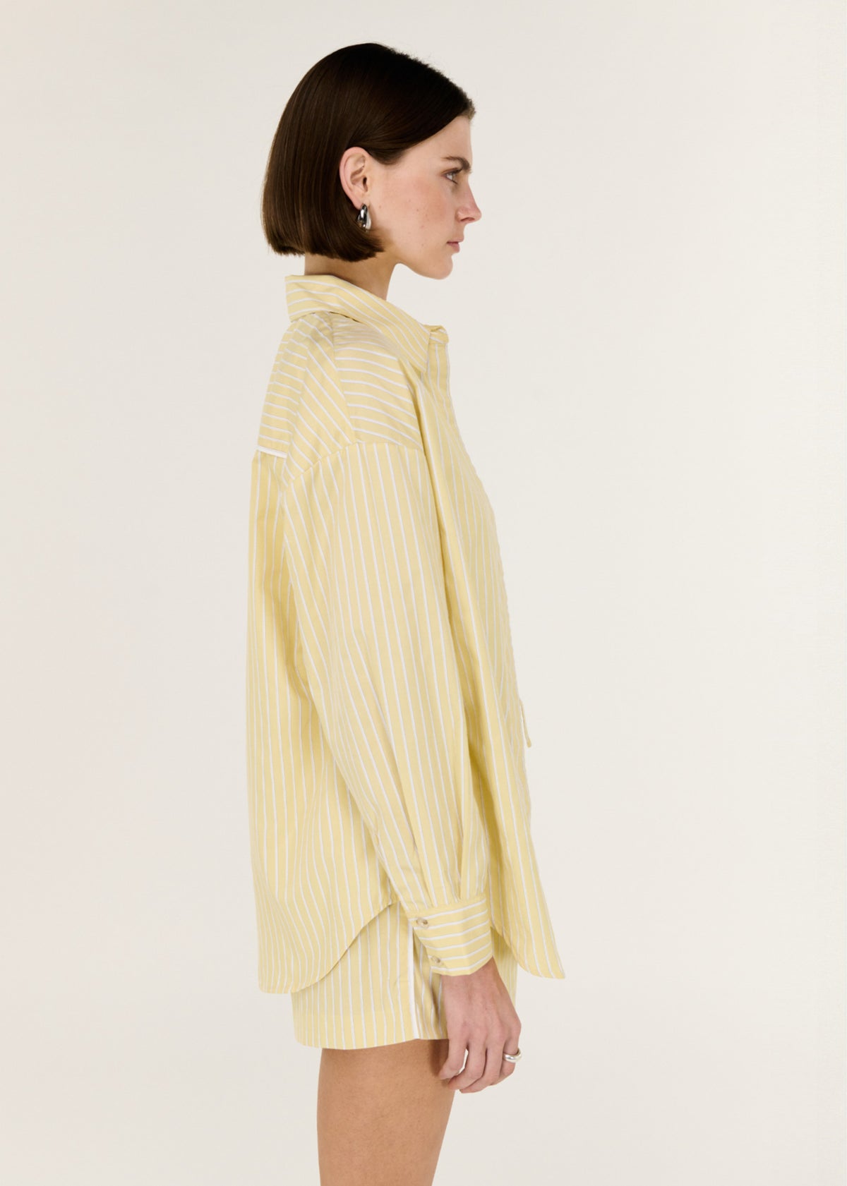 Side profile of the Butter Yellow Striped Shorts with a comfortable waist design and a clean, minimal silhouette.
