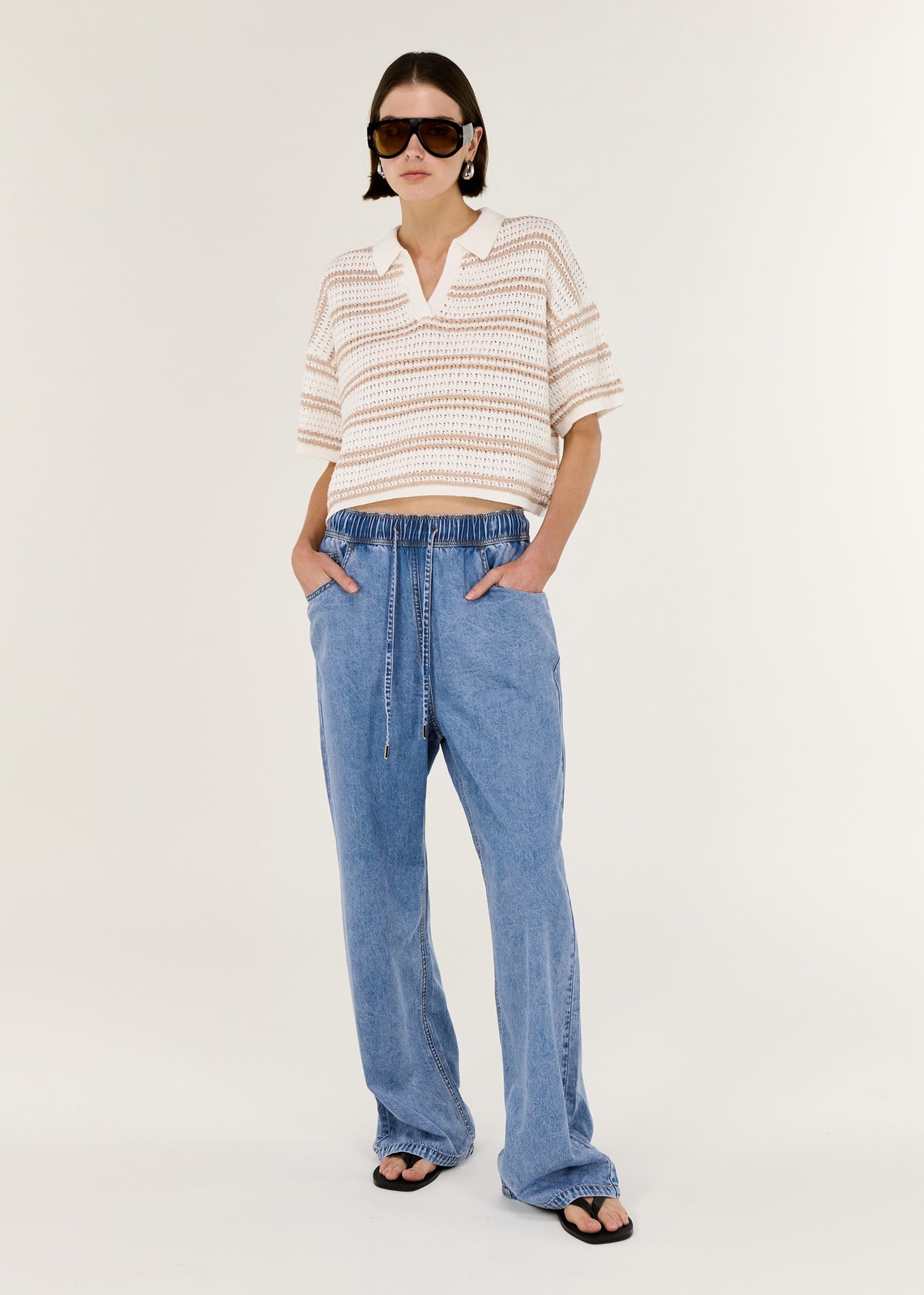 Model wearing Chambray Lightweight Elasticated Denim Pants with a relaxed straight-leg silhouette and an elasticated waistband.