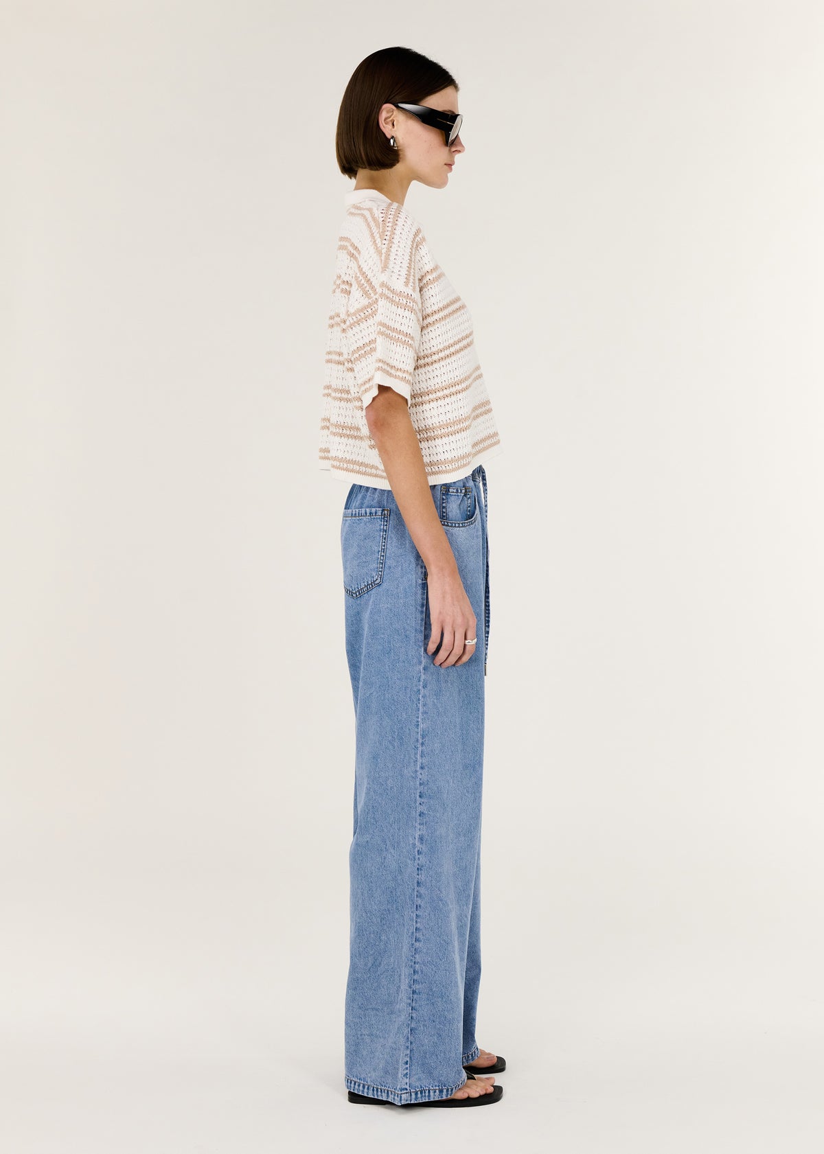 Side view of the Chambray Lightweight Elasticated Denim Pants, showing a designed and a colour: Light Denim.