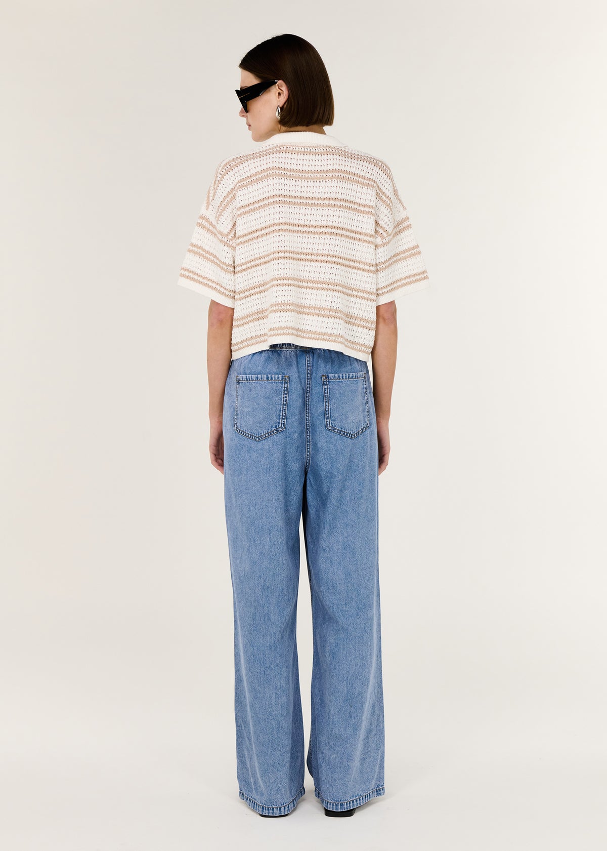Back view of the Chambray Lightweight Elasticated Denim Pants with a relaxed straight-leg silhouette and an elasticated waistband.
