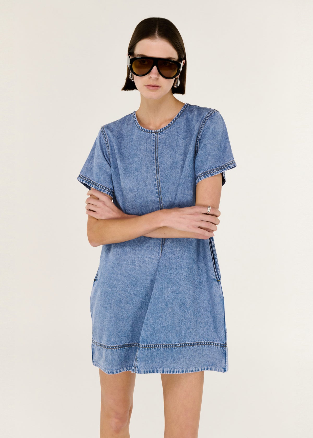 Close-up of the Chambray Lightweight Mini Dress, showing short sleeves and a back keyhole with button closure.