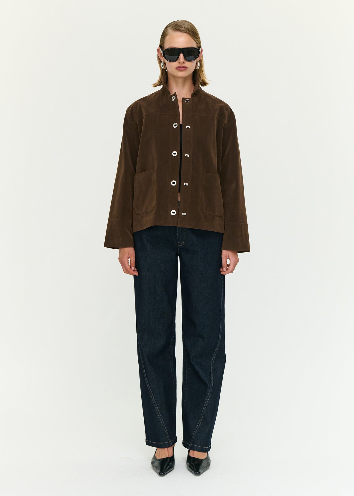 Model wearing Chocolate Brown Faux Suede Barn Jacket, showing a button front closure and front patch pockets.