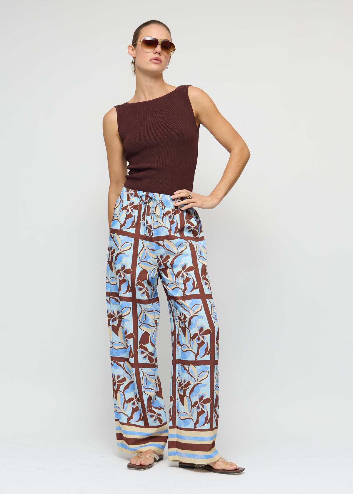 Side view of the Chocolate Brown Reversible Knit Tank Top, showing a reversible design: wear and a fitted rib knit silhouette.