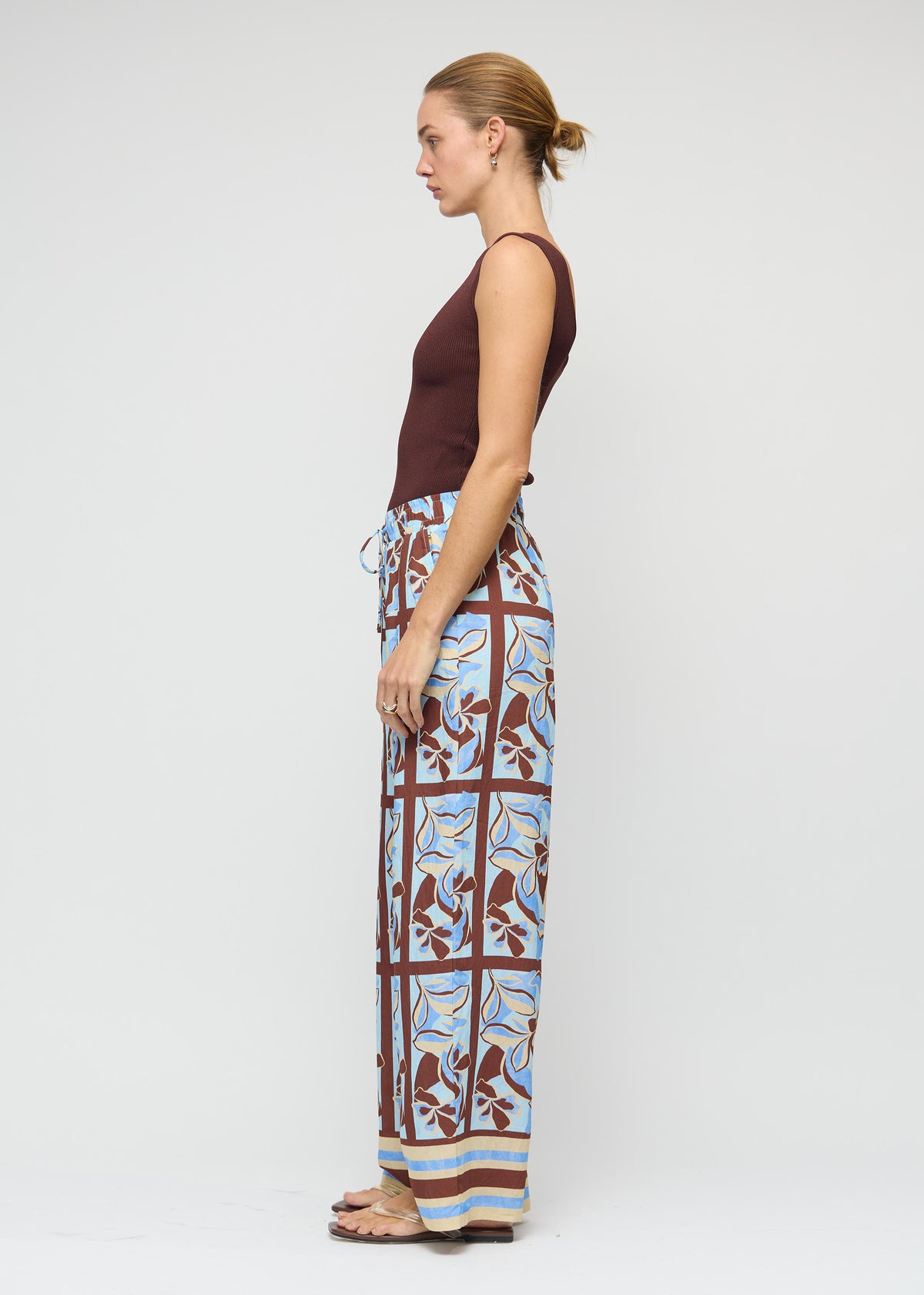 Side profile of the Chocolate Brown Reversible Knit Tank Top with a lightweight, stretchy fabric and a reversible design: wear.
