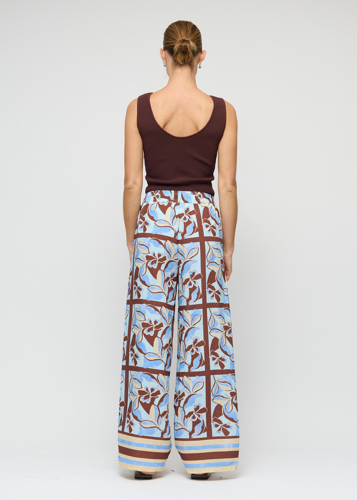 Back view of the Chocolate Brown Reversible Knit Tank Top, showing a reversible design: wear and a fitted rib knit silhouette.