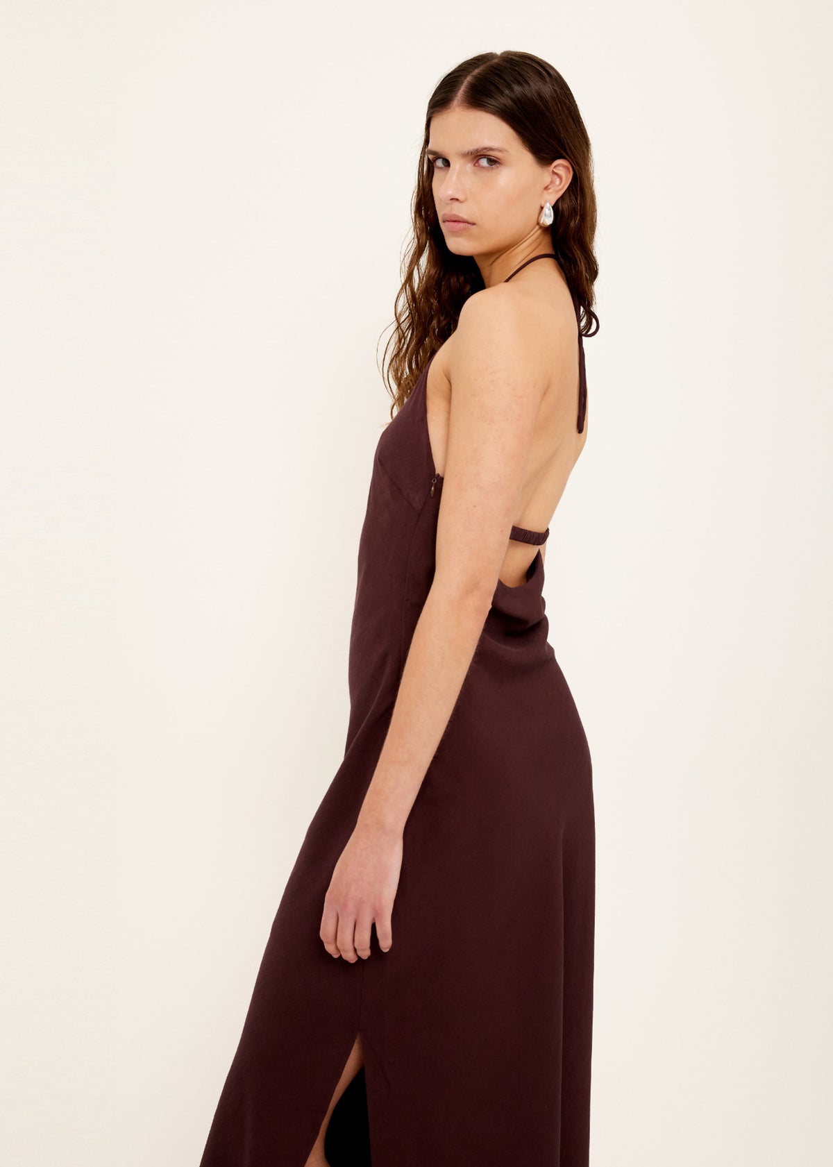 Side view of the Chocolate Halter Midi Dress, showing a midi length and a fully lined.