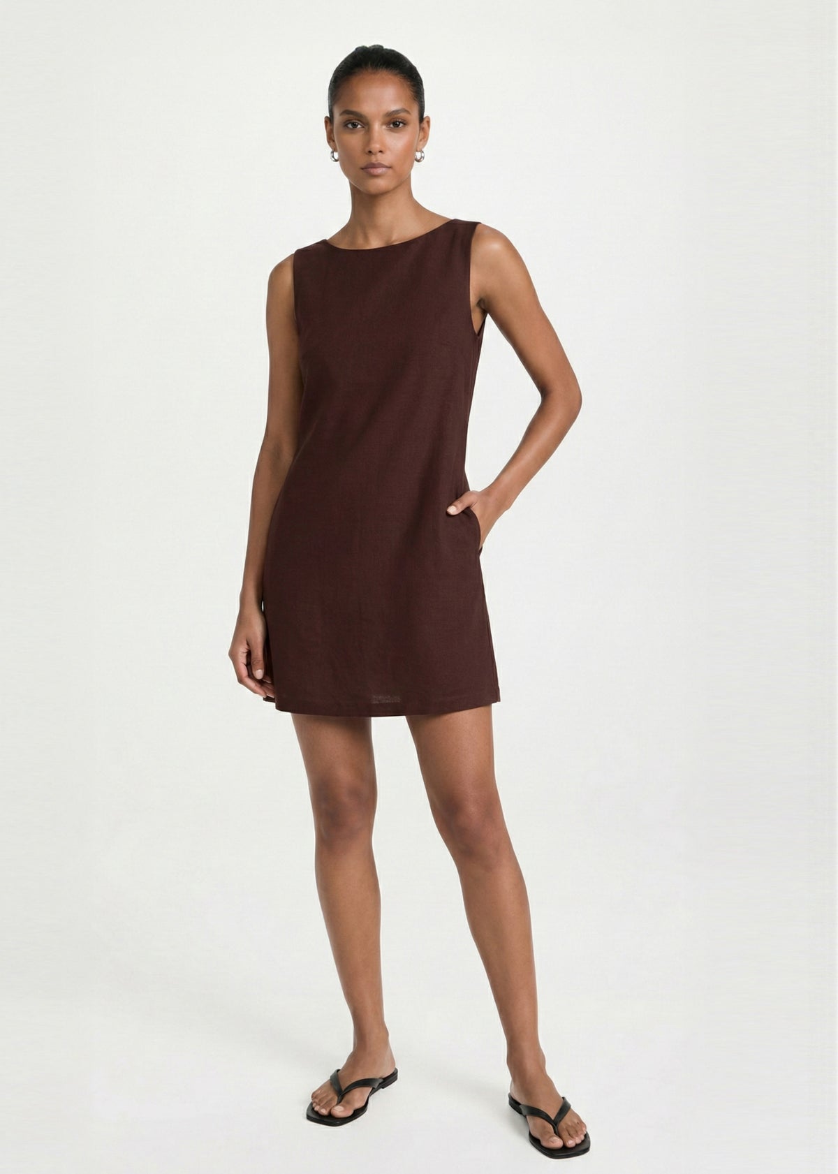 Model wearing Chocolate Linen Blend Boat Neck Mini Shift Dress, showing side pockets and a mini length.