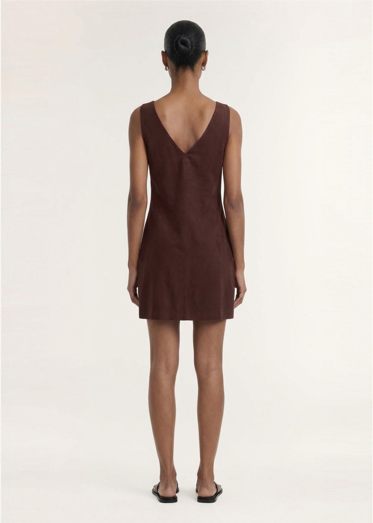 Back view of the Chocolate Linen Blend Boat Neck Mini Shift Dress, showing a v-back detail and a lightweight linen fabrication.