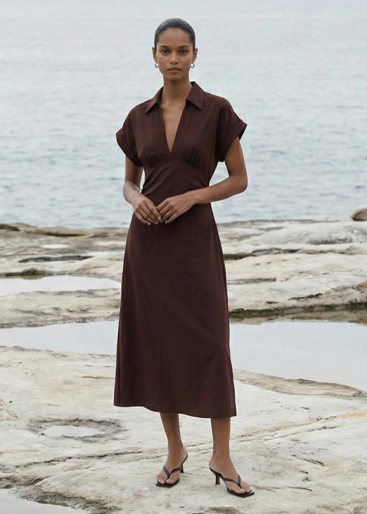 Model wearing Chocolate Linen Blend Collared Midi Dress, showing cap sleeves and a gathered empire seam.