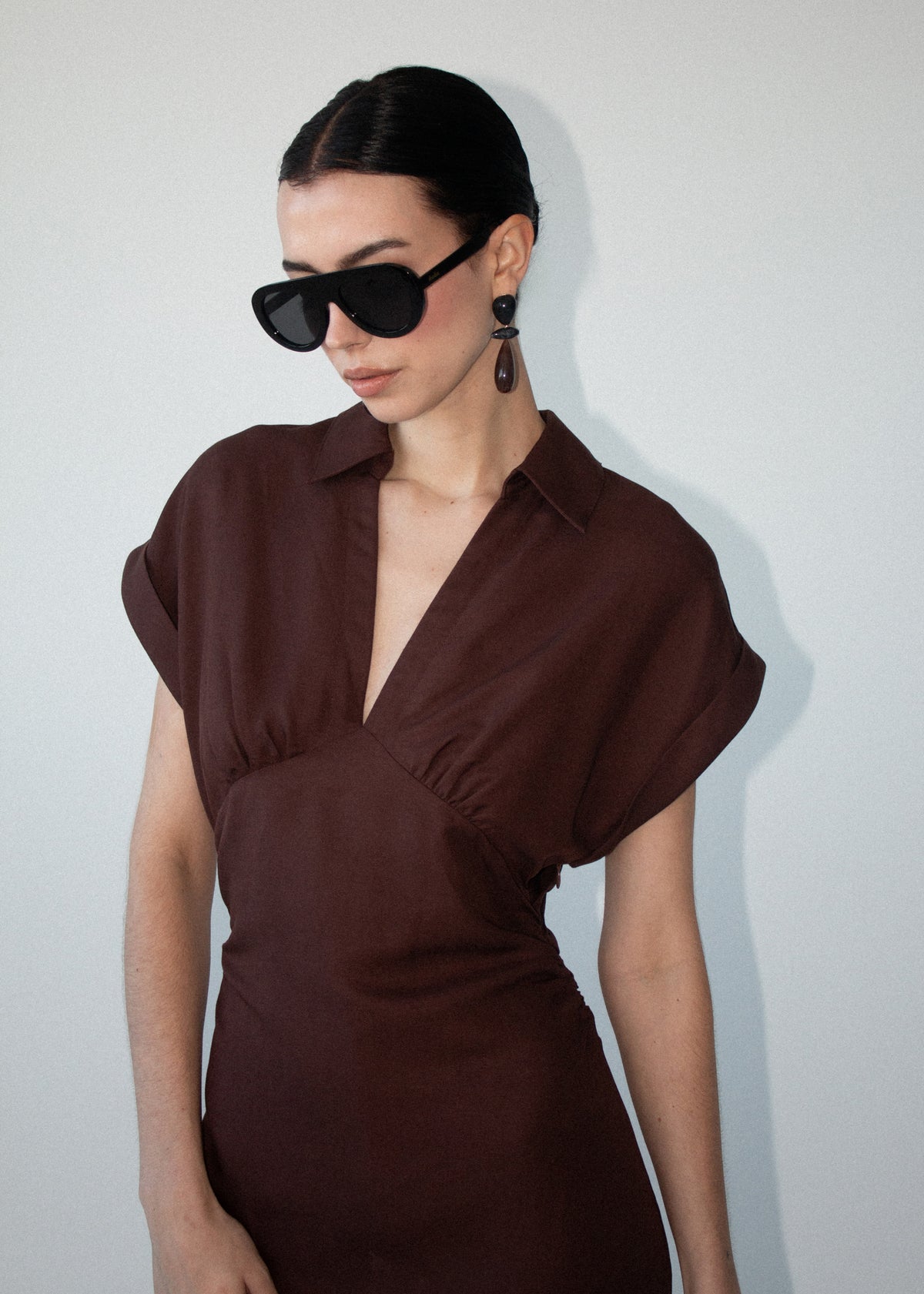 Close-up of Chocolate Linen Blend Collared Midi Dress with a collared V-neckline and cap sleeves.