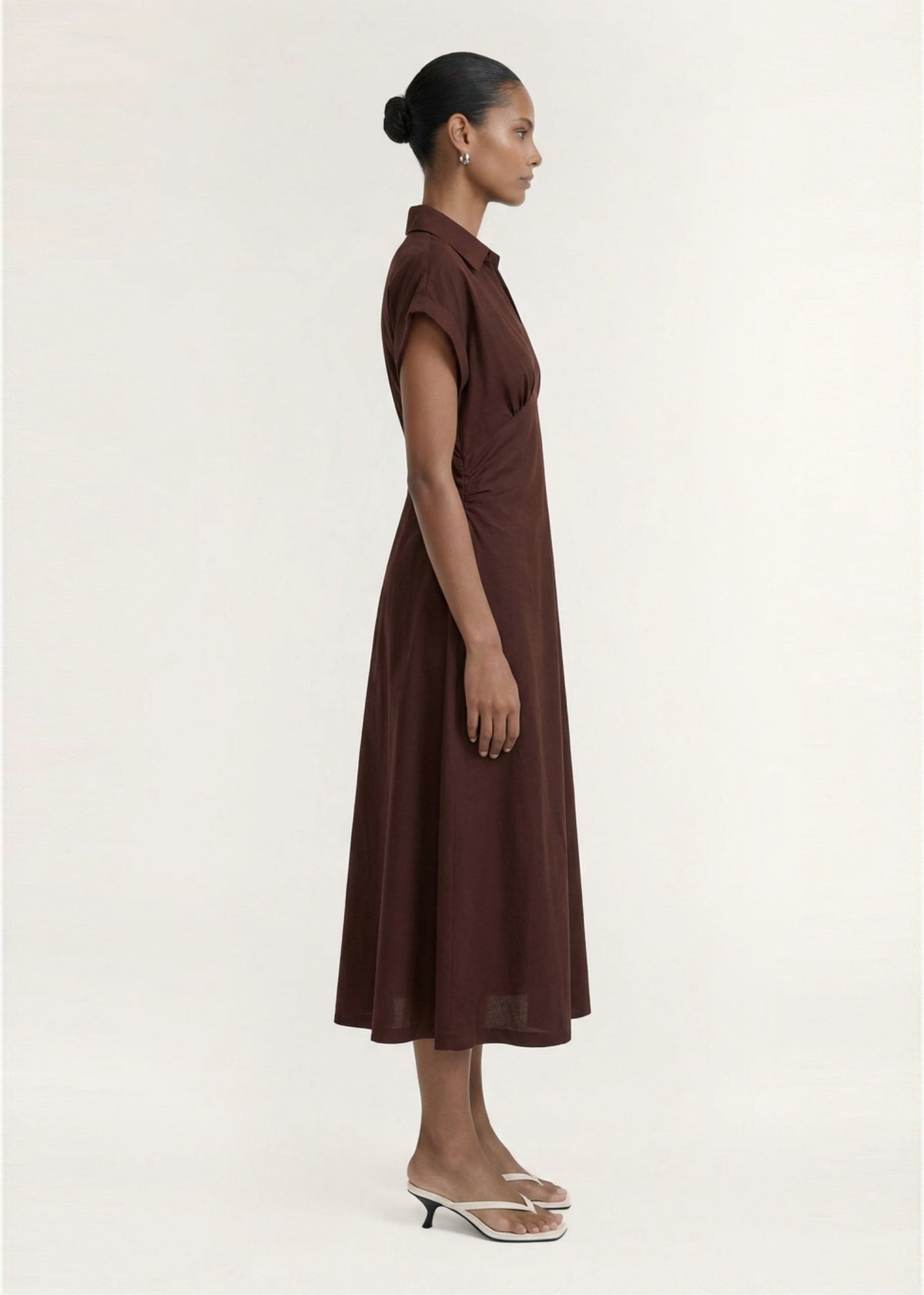 Side view of the Chocolate Linen Blend Collared Midi Dress, showing a lightweight woven fabrication and a collared V-neckline.