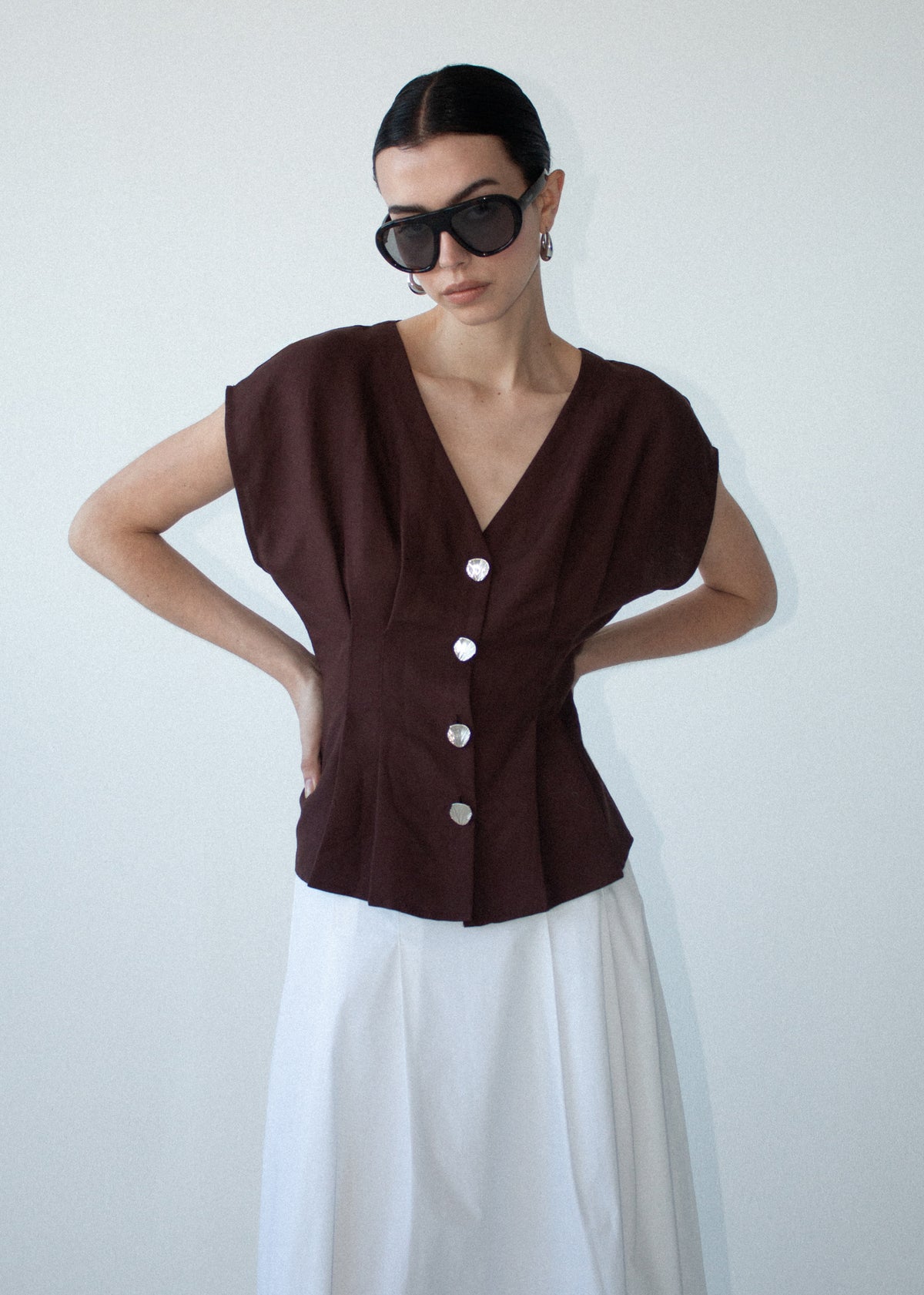 Close-up of the Chocolate Linen Blend V-Neck Cropped Top, showing a plunging V-neckline and dolman sleeves.