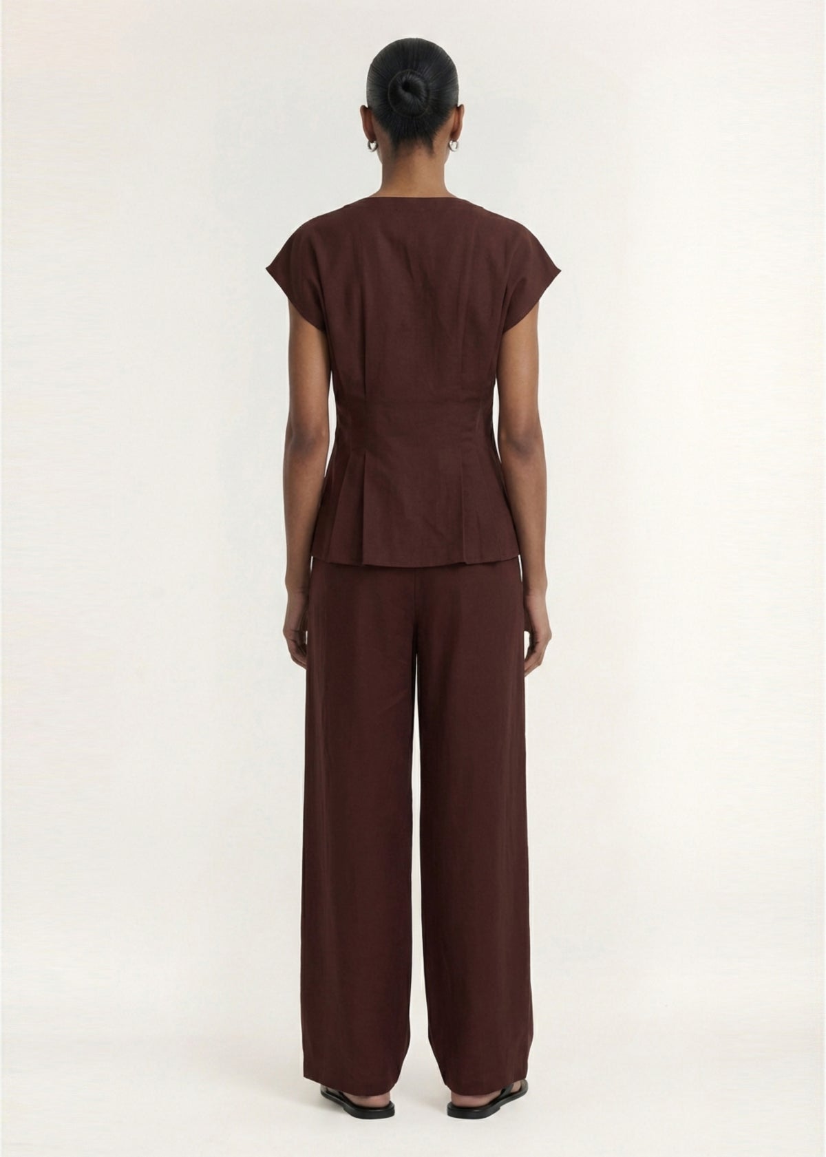 Back view of the Chocolate Linen Blend Wide Leg Tailored Pant with a button and zip fly closure.