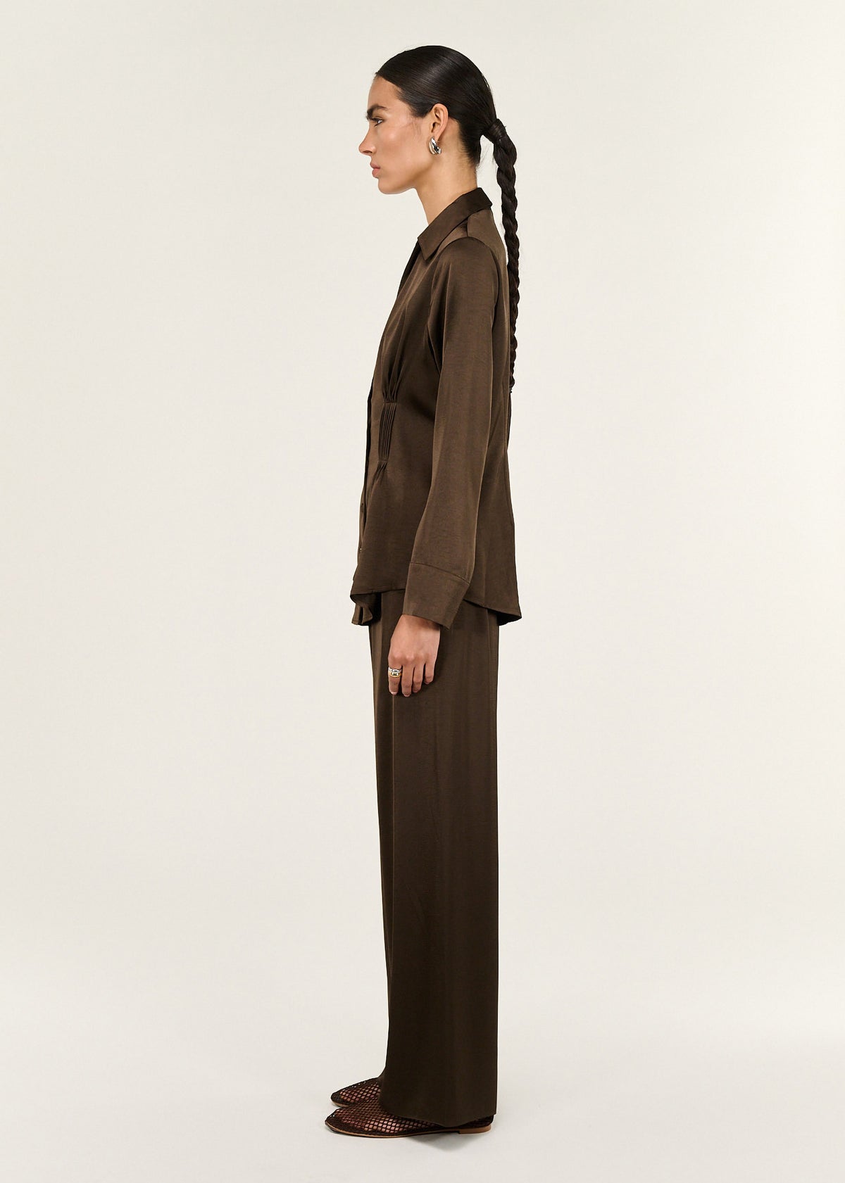 Side view of the Chocolate Pintuck Cinched Waist Satin Shirt, showing a full button-through front and a classic collar.