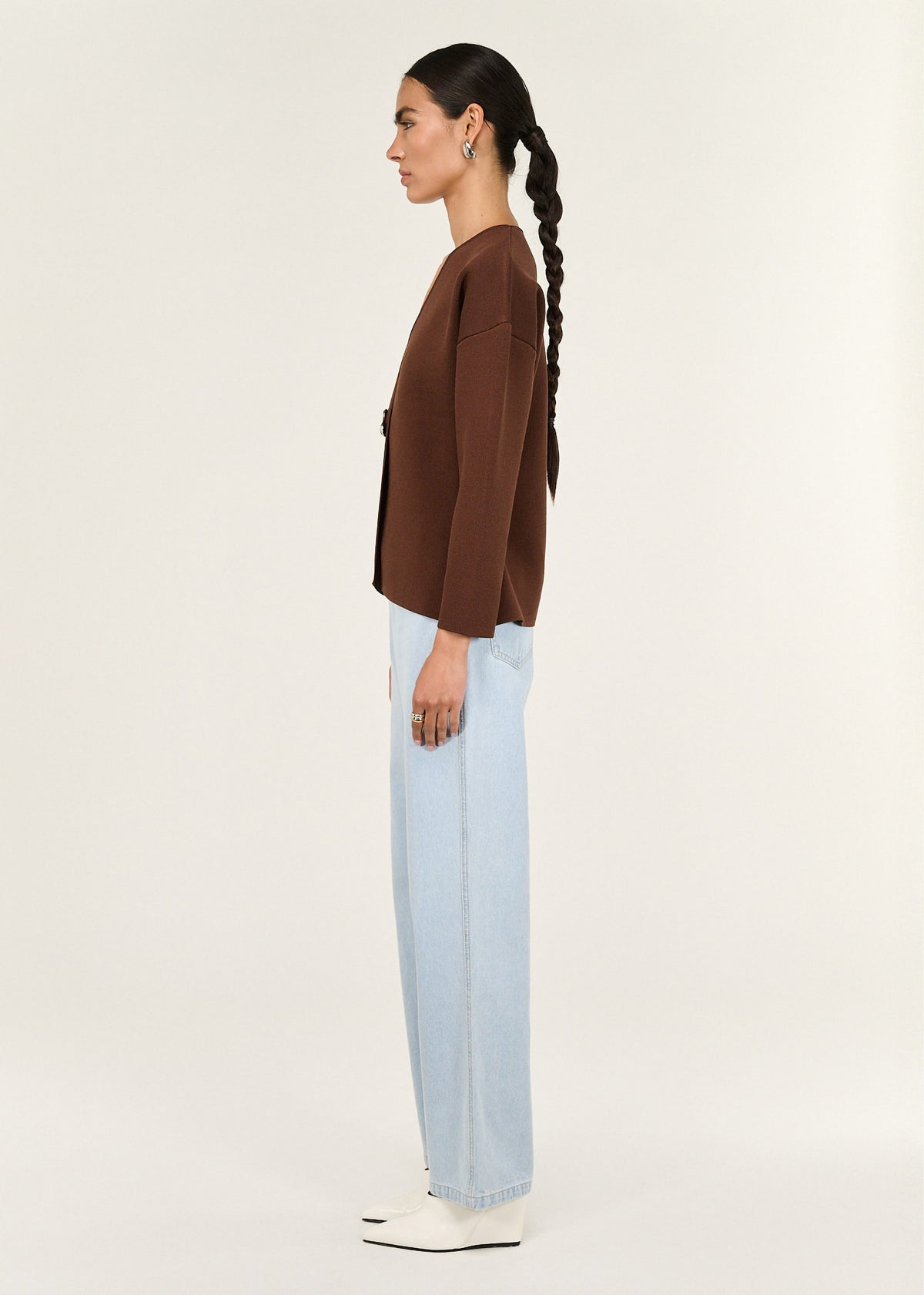 Side view of the Chocolate Sculptured Soft Cardigan with Hardware Detail, showing a relaxed fit with subtle shaping and long sleeves.