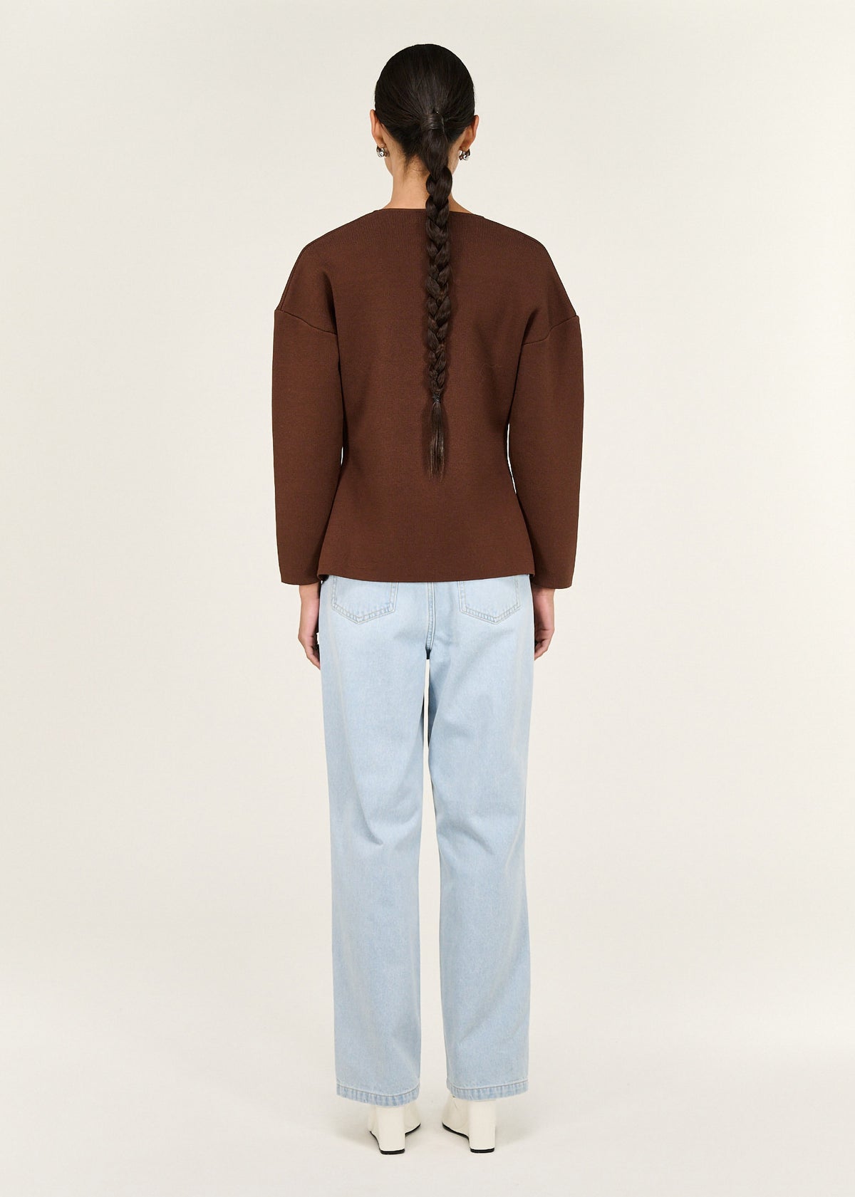 Back view of the Chocolate Sculptured Soft Cardigan with Hardware Detail with an asymmetrical button closure.