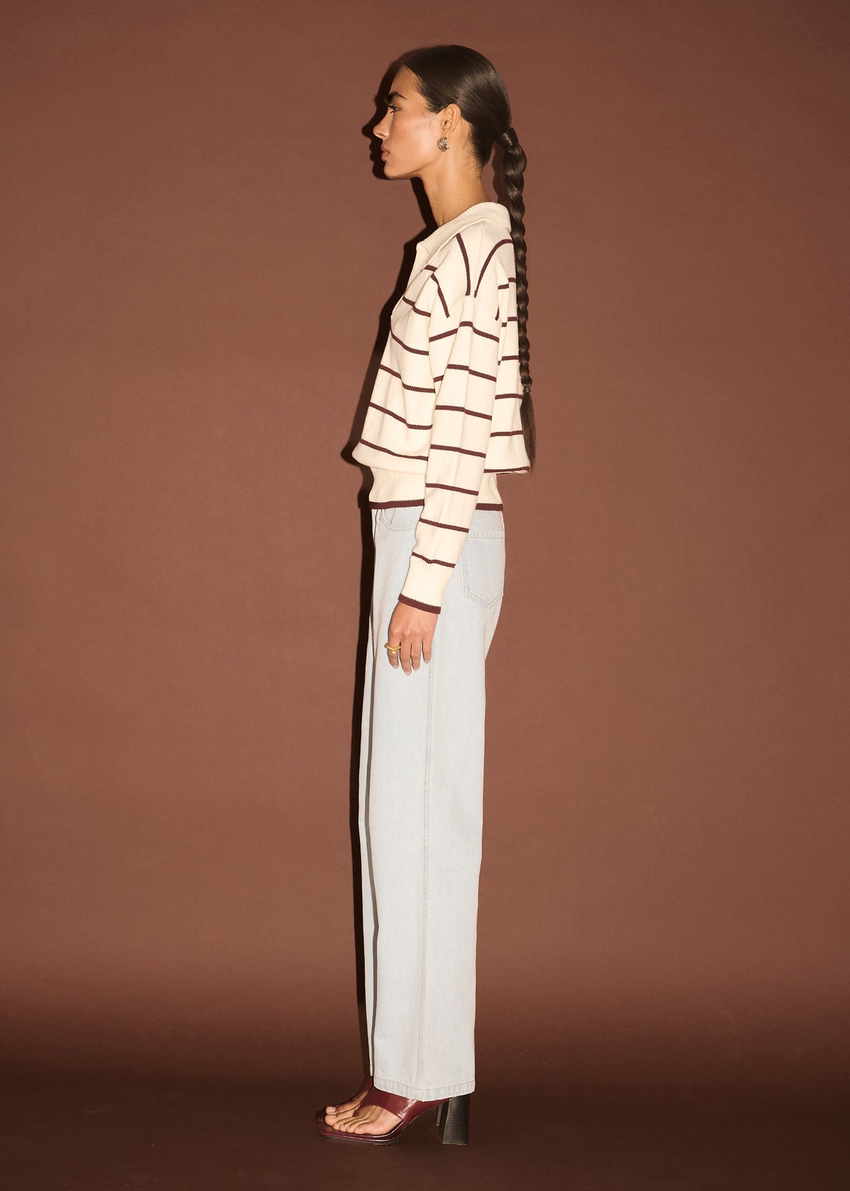 Side view of the Chocolate Stripe Polo Knit Jumper, showing an all-over stripe design and a soft knit fabrication.