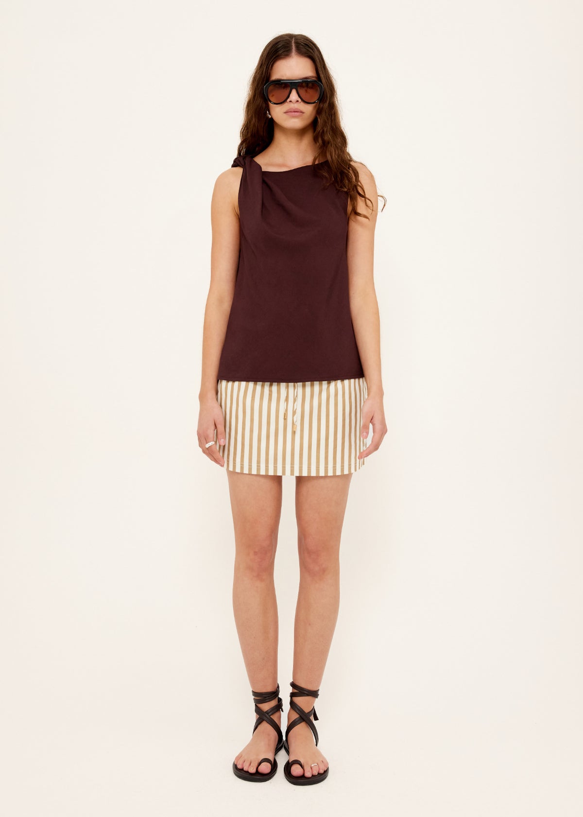 Model wearing Chocolate Twist Top, showing a lightweight stretch fabrication and a relaxed sleeveless fit.