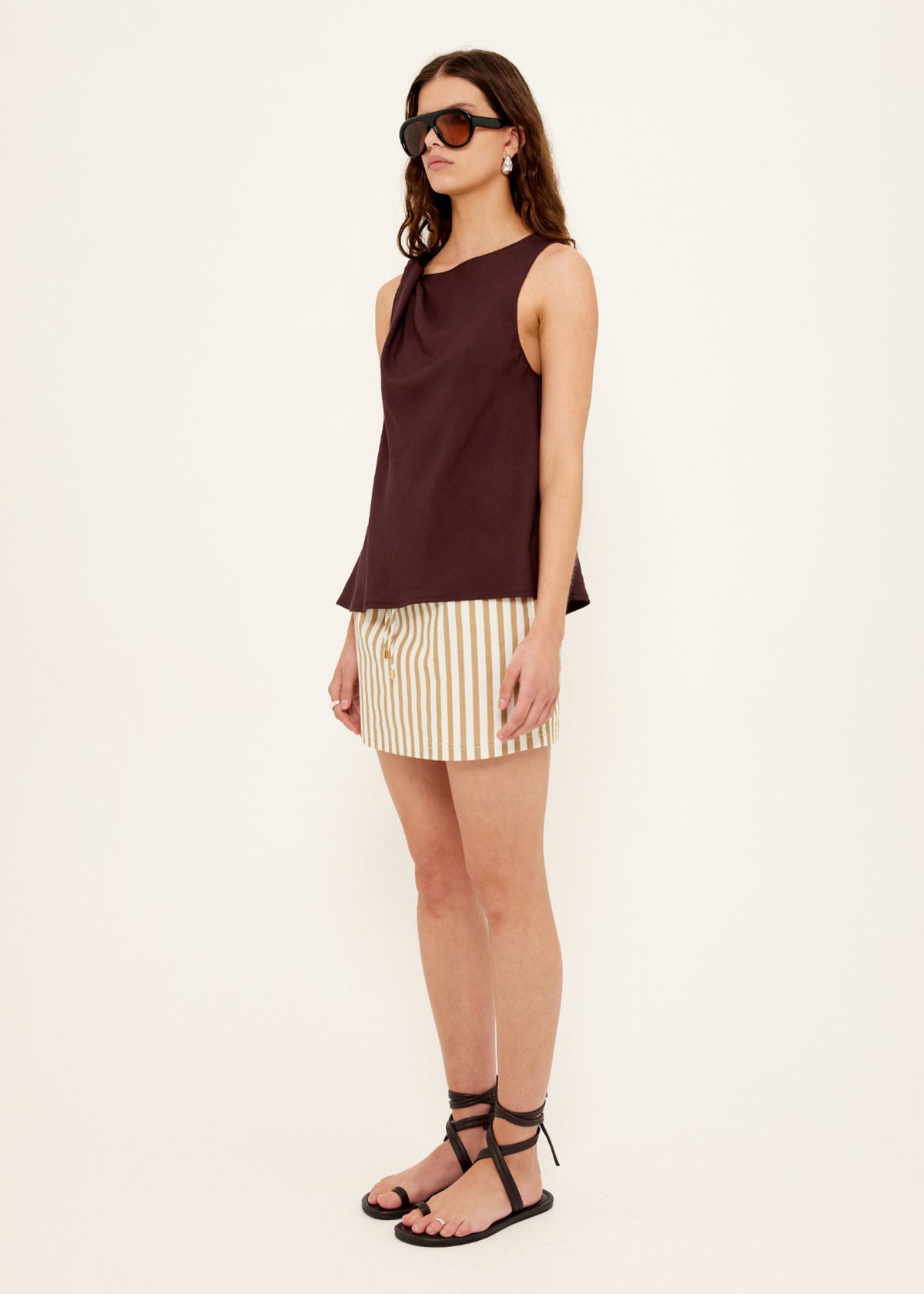 Side view of the Chocolate Twist Top, showing a soft cowl neckline and a shoulder twist detail.