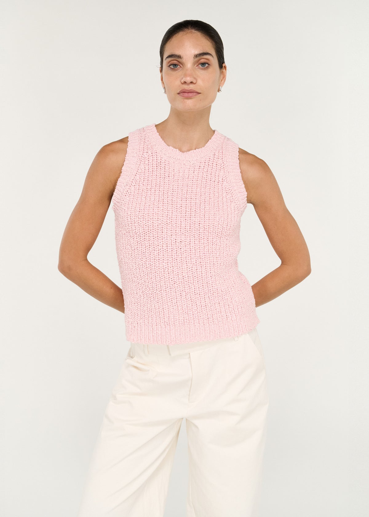 Close-up of the Cotton Blend Knit Tank in Soft Pink, showing a sleeveless silhouette and a crew neckline.