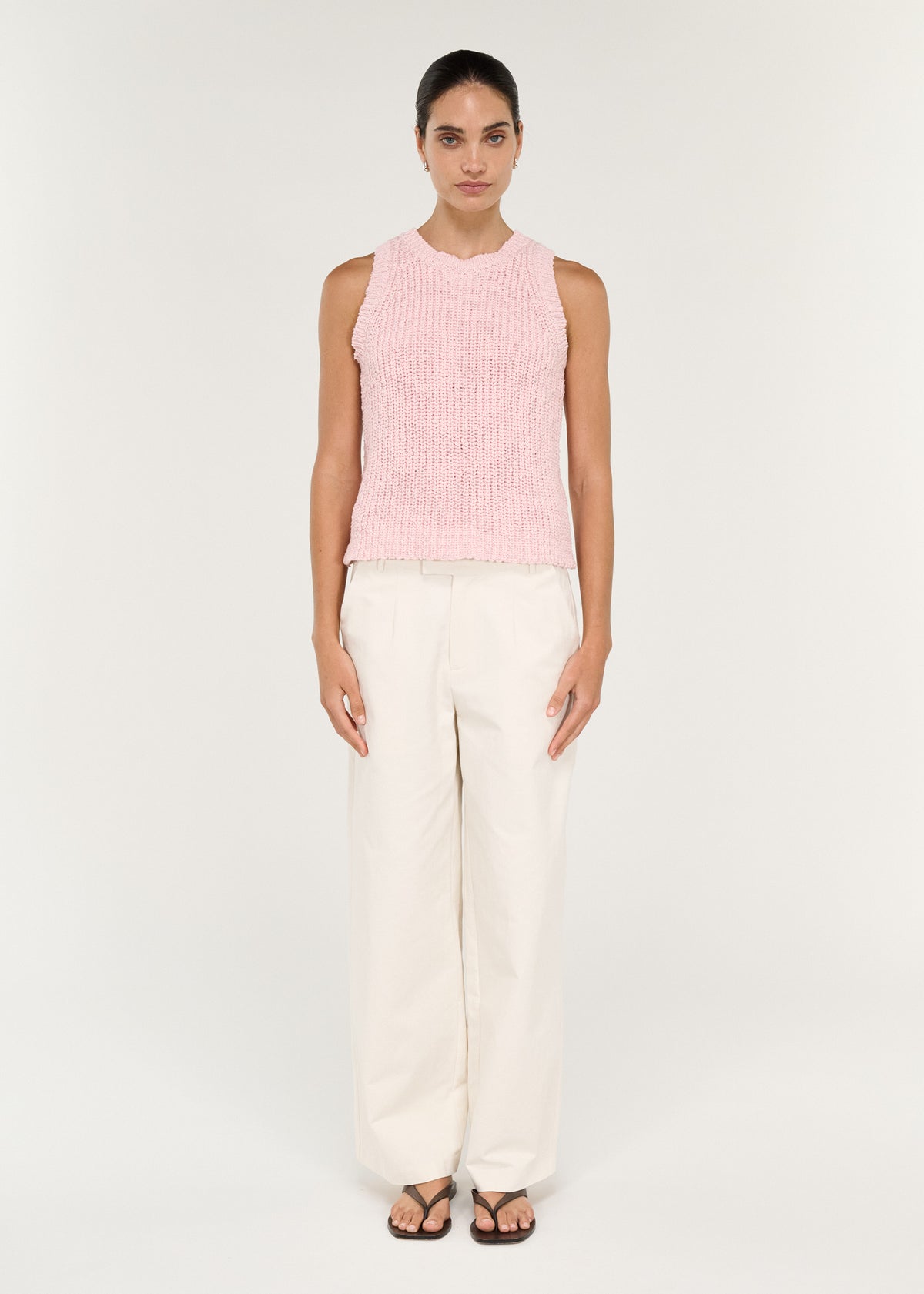 Model wearing Cotton Blend Knit Tank in Soft Pink with a sleeveless silhouette and a crew neckline.