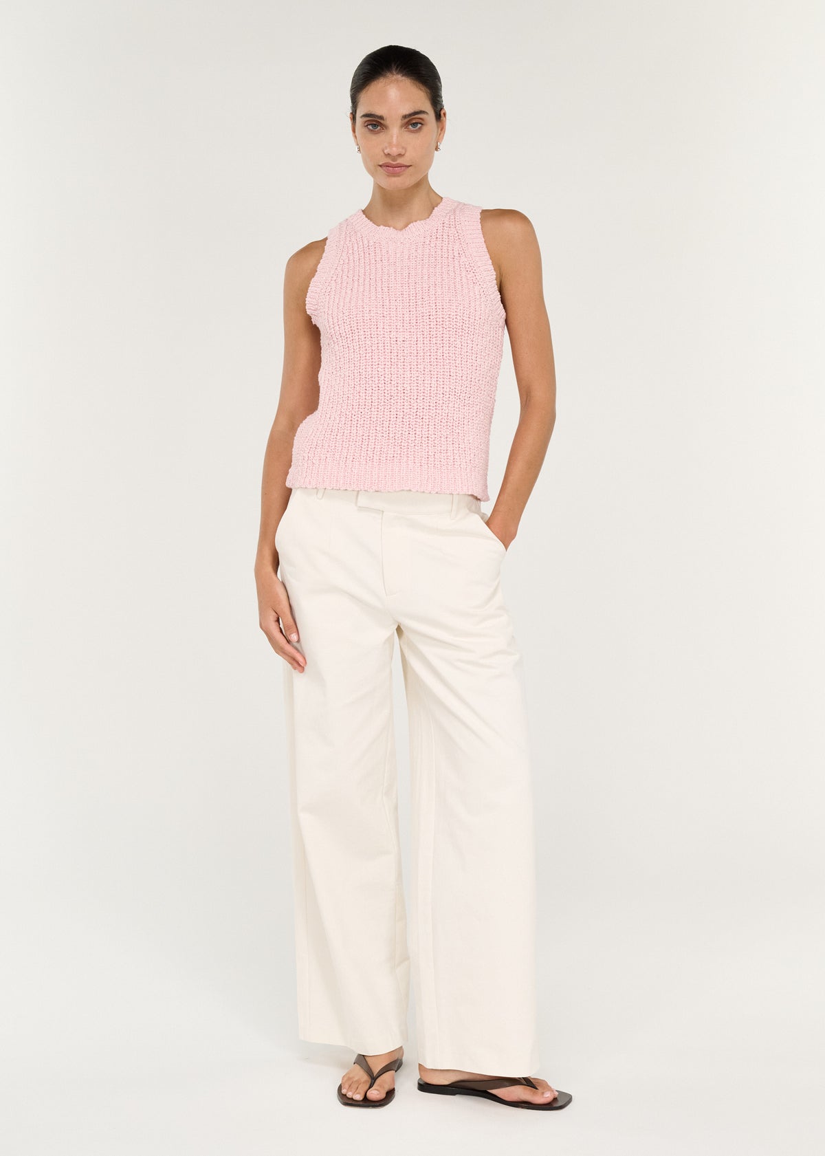 Model wearing Cotton Blend Knit Tank in Soft Pink, showing a close fit through the body.
