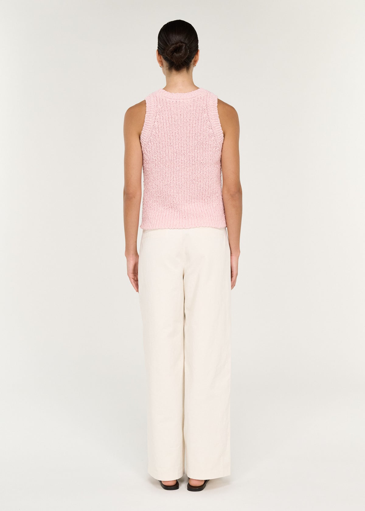 Back view of the Cotton Blend Knit Tank in Soft Pink with a textured open knit fabrication and a soft pink hue.