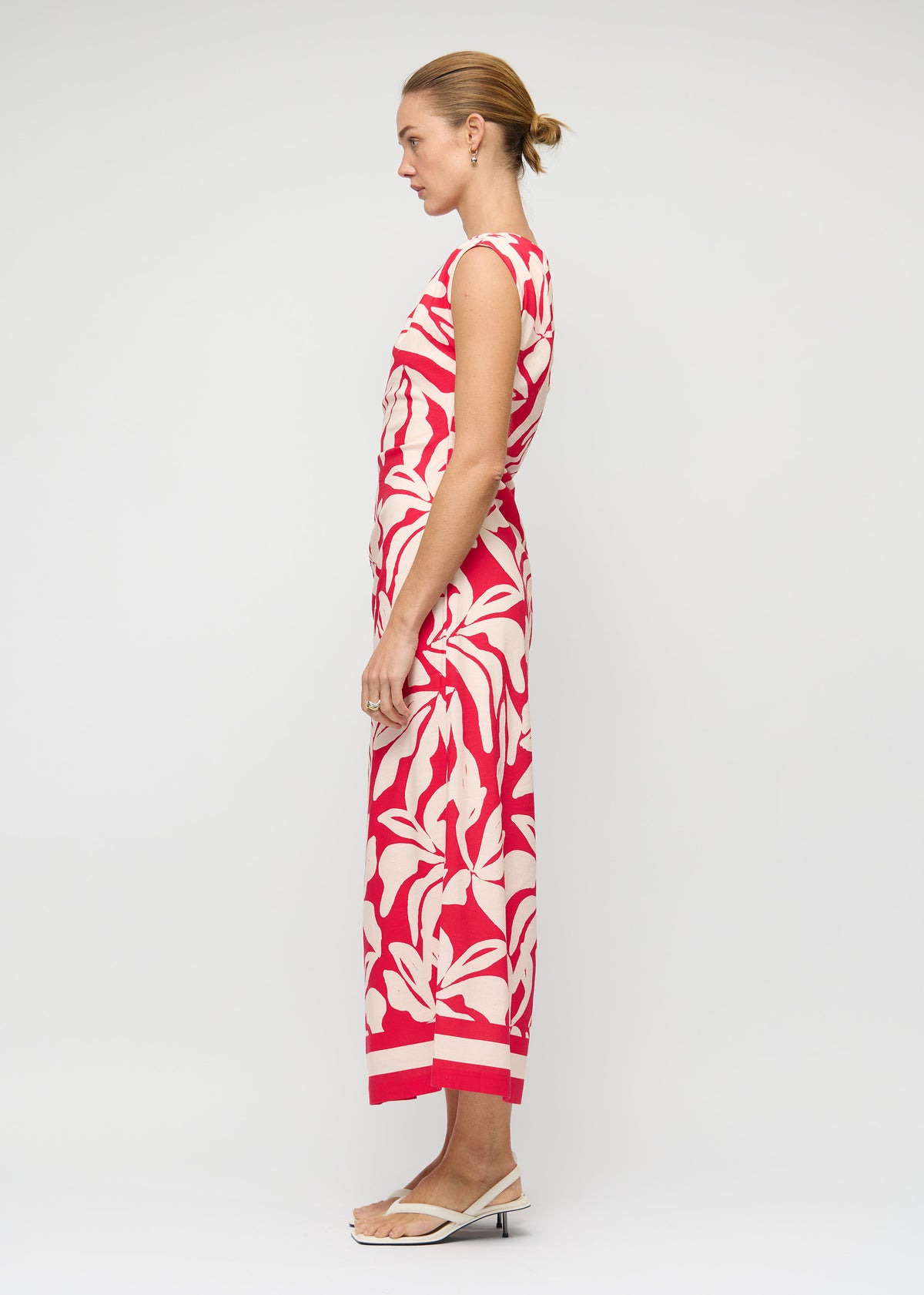 Side view of the Cotton Blend Red and White Floral Asymmetrical Midi Dress, showing a midi length and a fully lined.