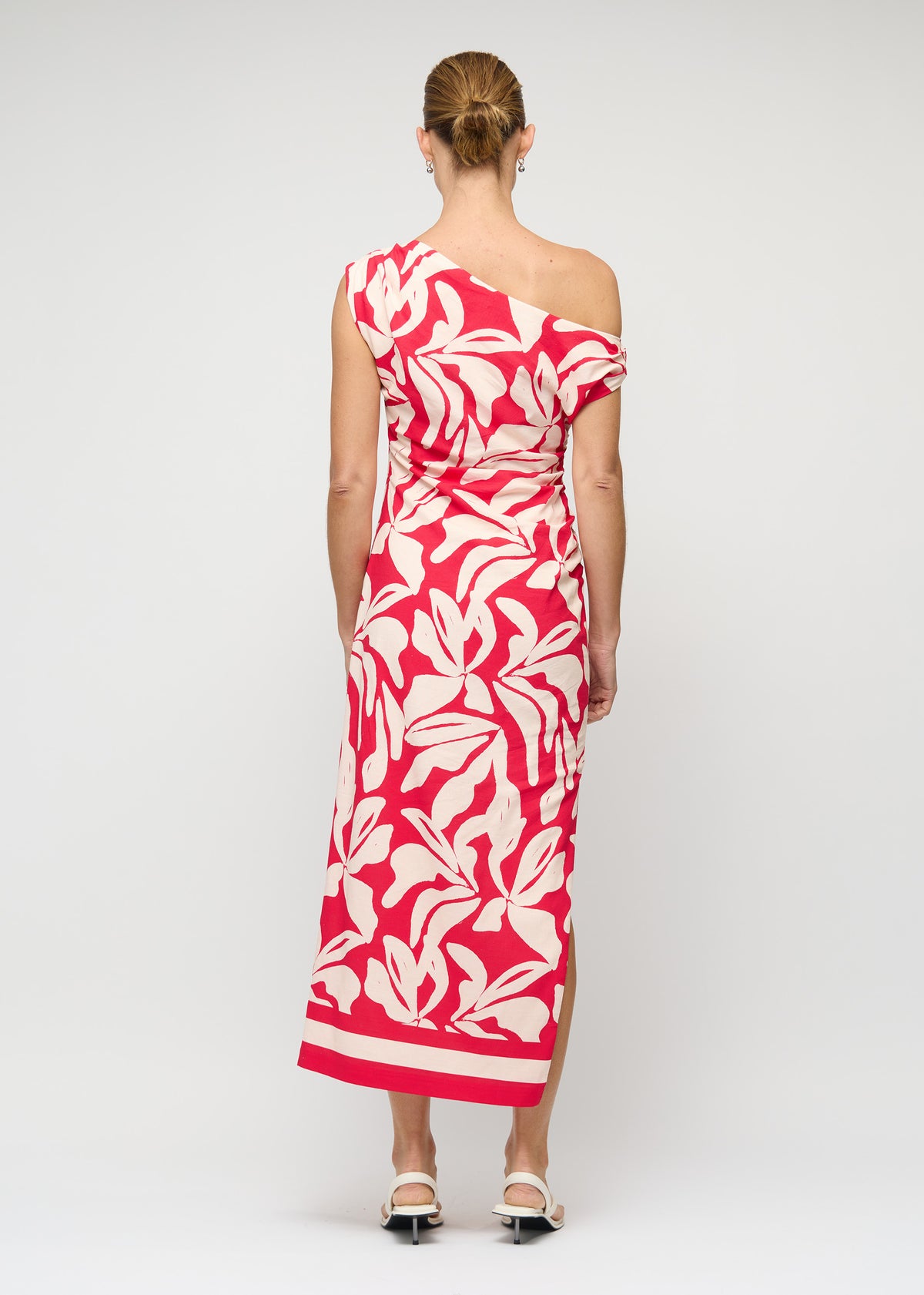 Back view of the Cotton Blend Red and White Floral Asymmetrical Midi Dress with an exclusive Staple the Label print.