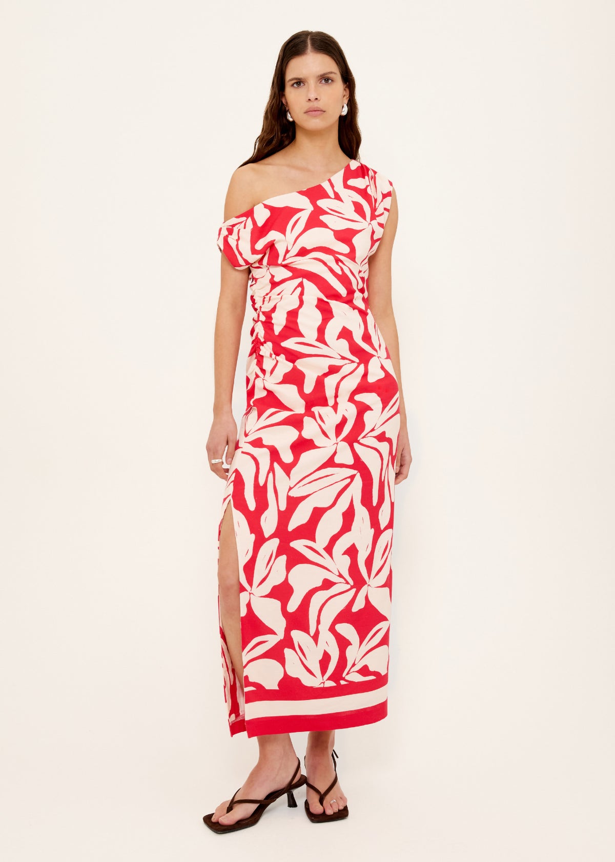 Model wearing Cotton Blend Red and White Floral Asymmetrical Midi Dress, showing a flattering fitted silhouette and a side split hem.