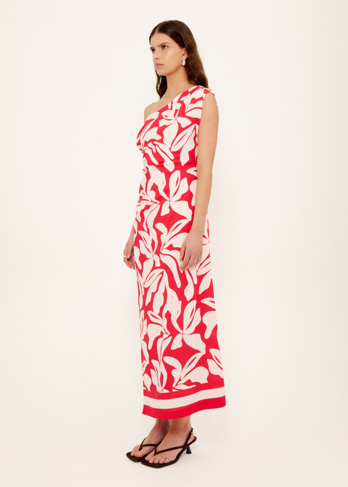 Side profile of the Cotton Blend Red and White Floral Asymmetrical Midi Dress with a midi length and a fully lined.