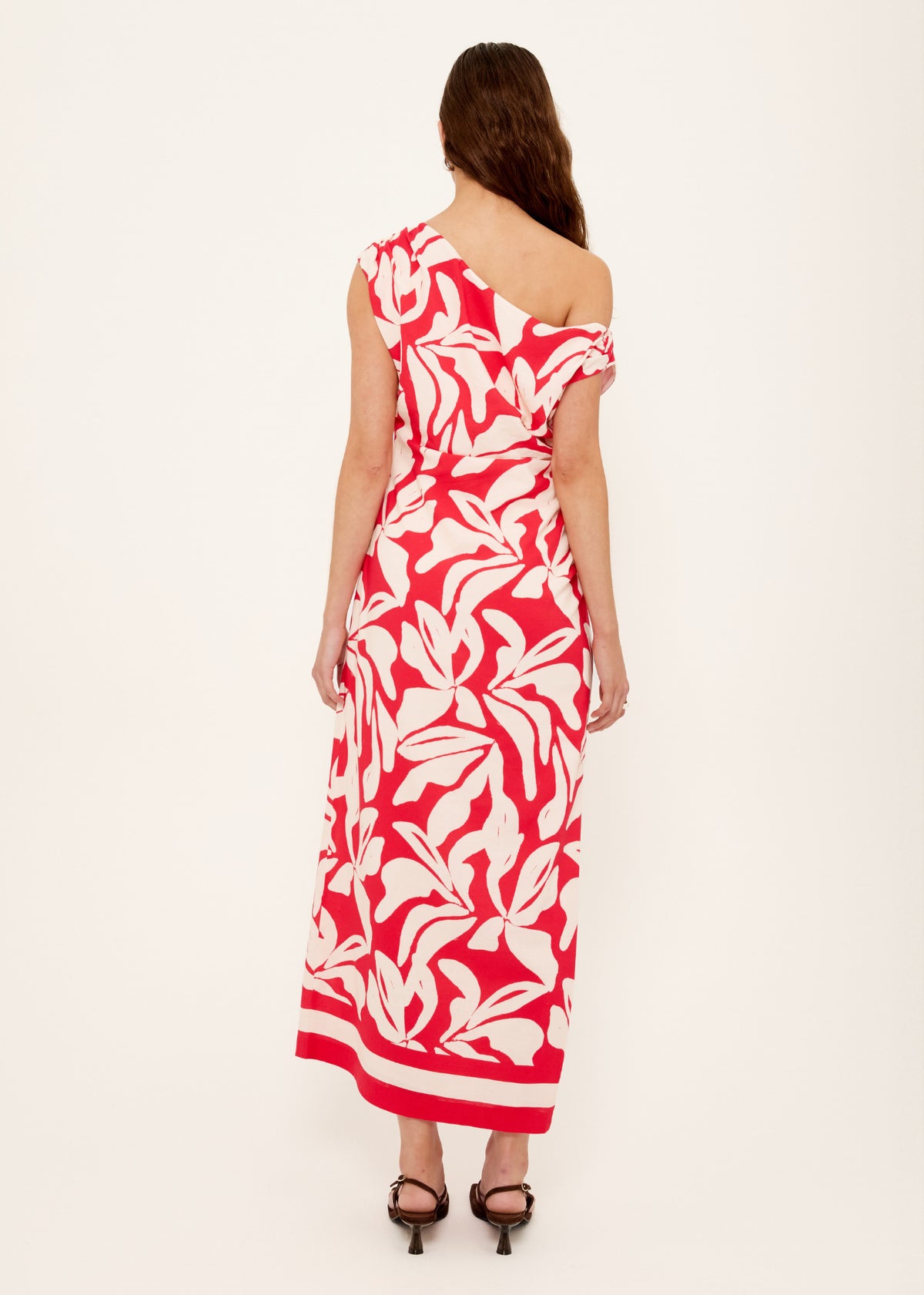 Back view of the Cotton Blend Red and White Floral Asymmetrical Midi Dress, showing an exclusive Staple the Label print.