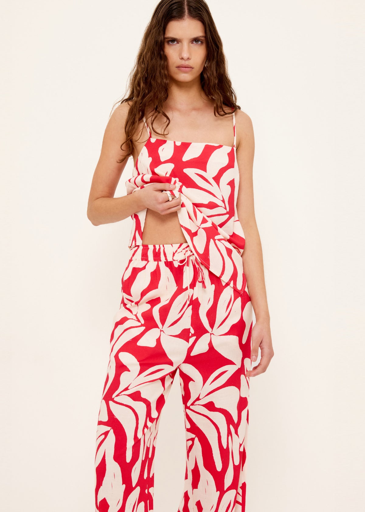 Close-up of the Cotton Blend Red and White Floral Print Cami Top, showing a straight neckline with relaxed fit.