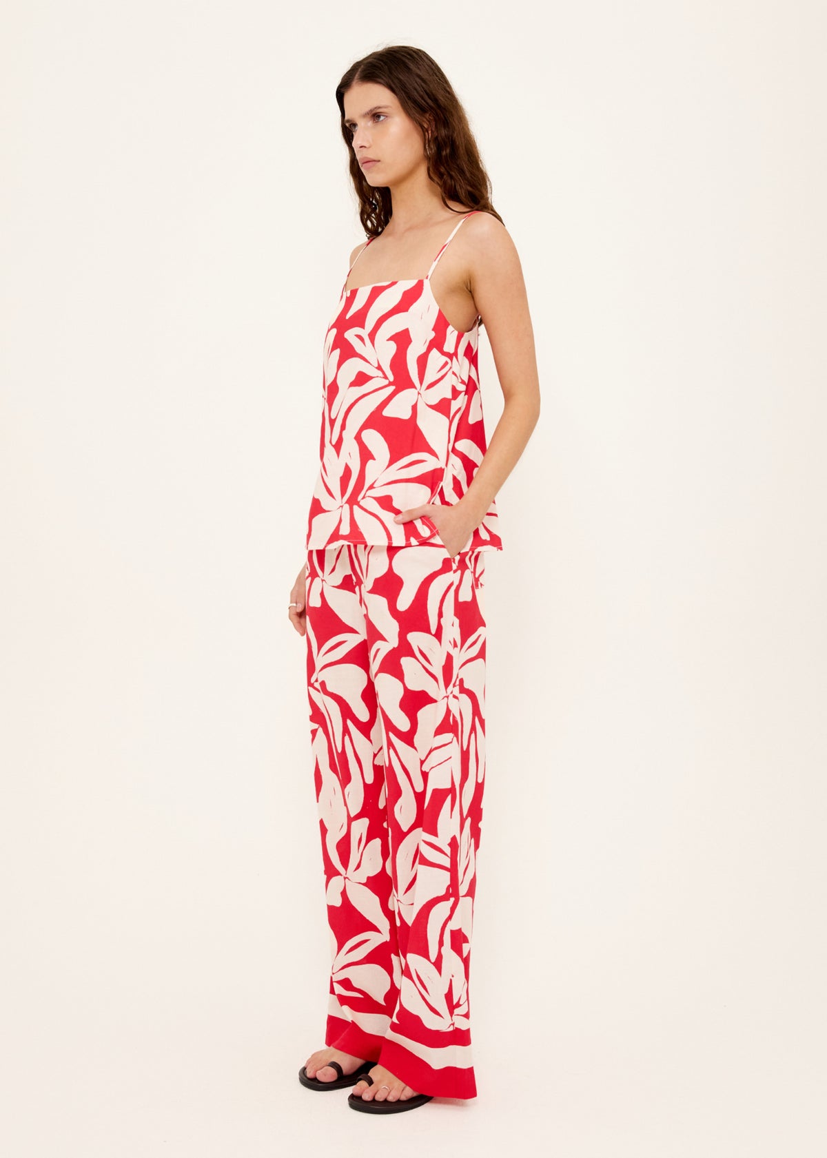 Side view of the Cotton Blend Red and White Floral Print Cami Top, showing an exclusive Staple the Label print.