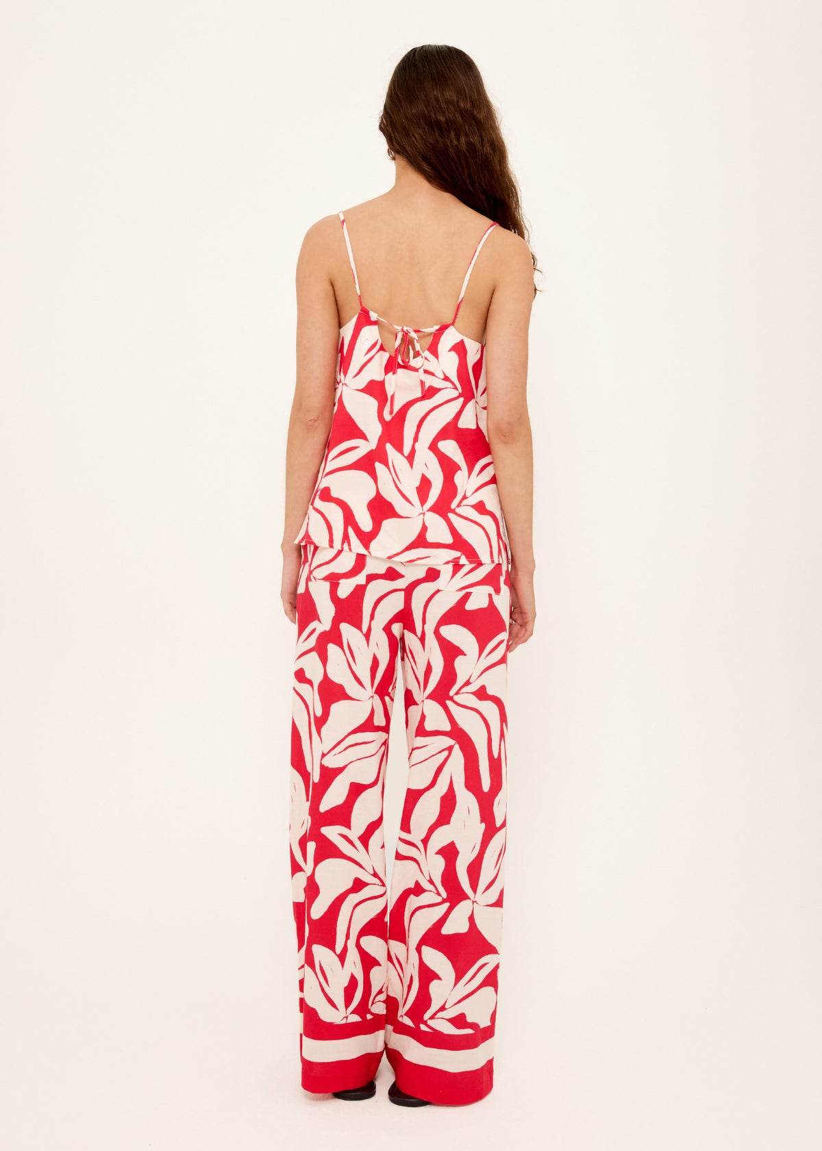 Back view of the Cotton Blend Red and White Floral Print Cami Top with adjustable tie-back straps and an exclusive Staple the Label print.