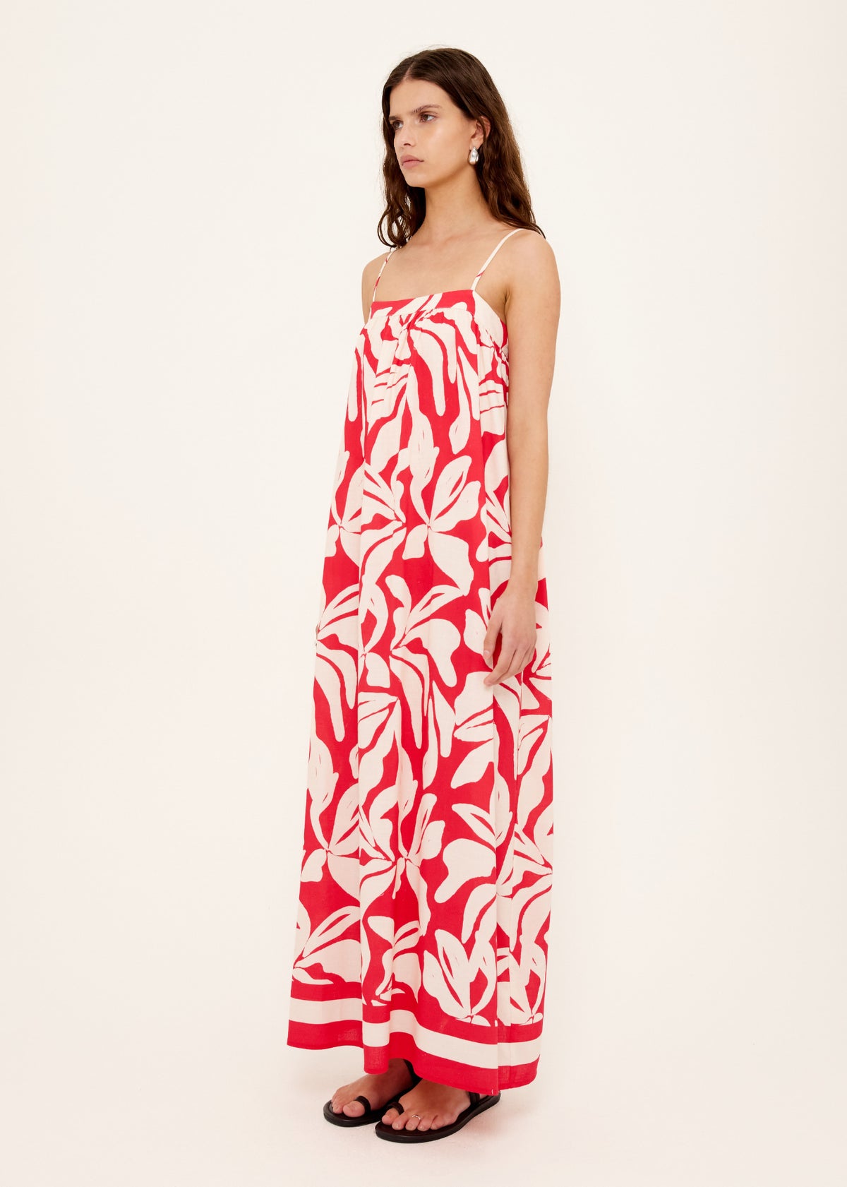 Model wearing Cotton Blend Red and White Floral Print Maxi Dress with a relaxed, free-flowing fit and an exclusive Staple the Label print.