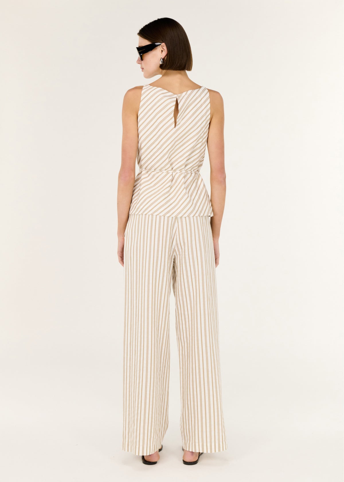 Back view of the Cotton Blend Stripe Tie Waist Top with an adjustable tie waist and a sleeveless cut.