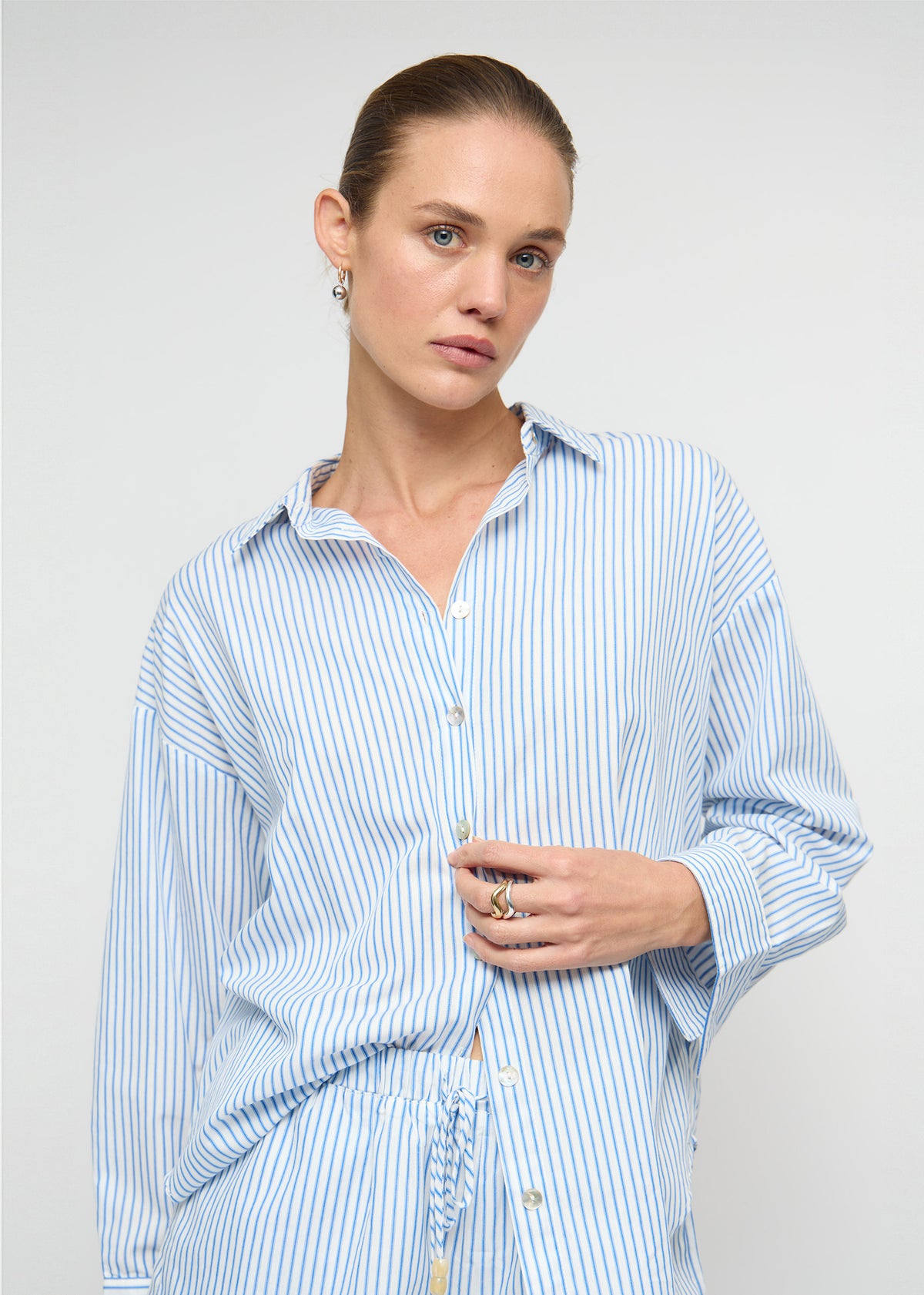 Close-up detail of the Cotton Blue and White Oversized Shirt, showing button placket.