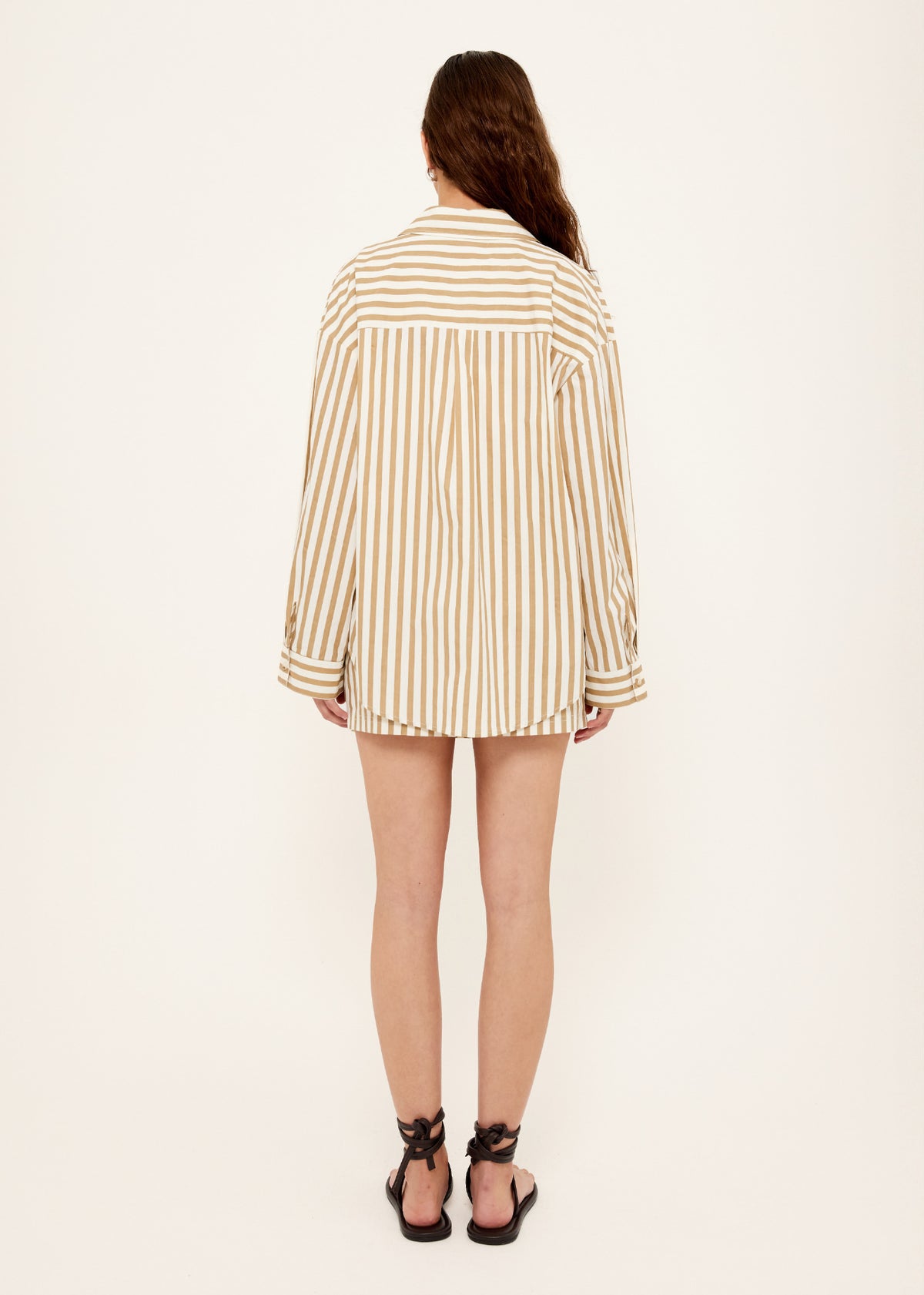 Back view of the Cotton Oversized Stripe Shirt with a button-through front and long sleeves with button cuffs.