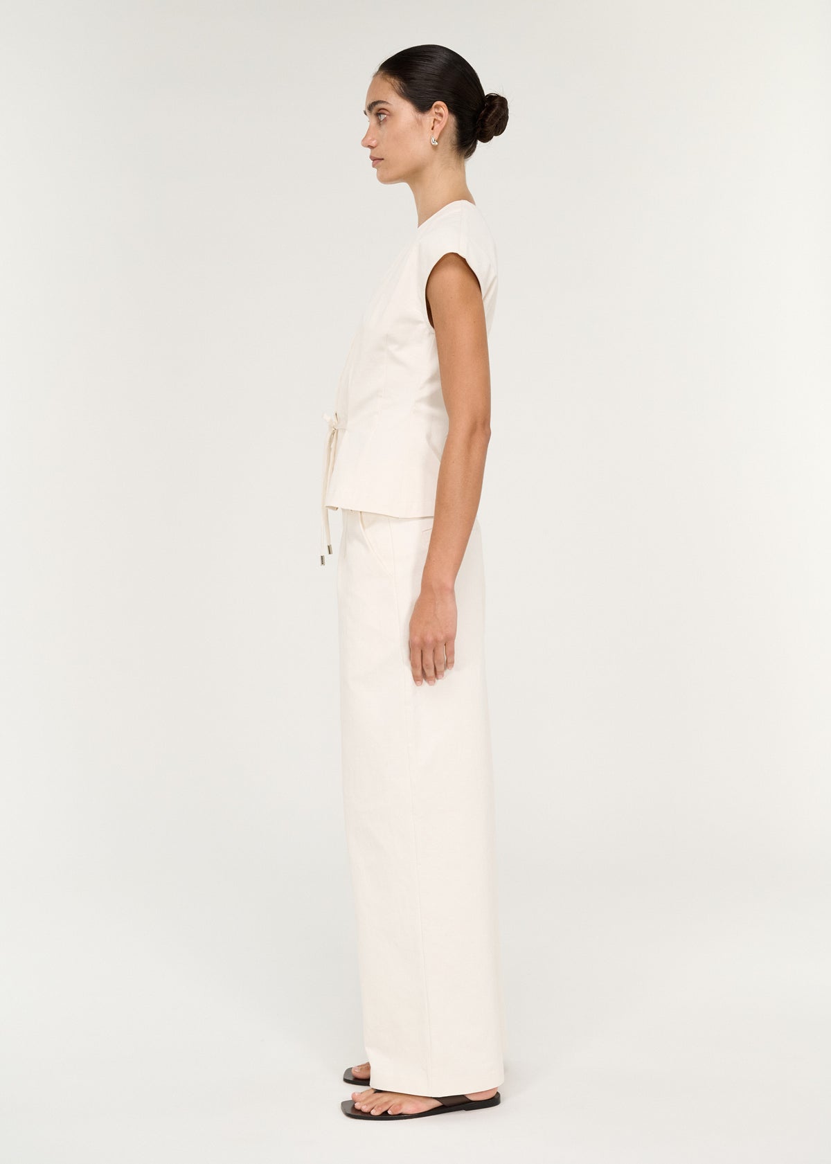 Side view of the Cotton Tie Front Top with Cap Sleeve, showing a v-neckline and extended cap sleeves.