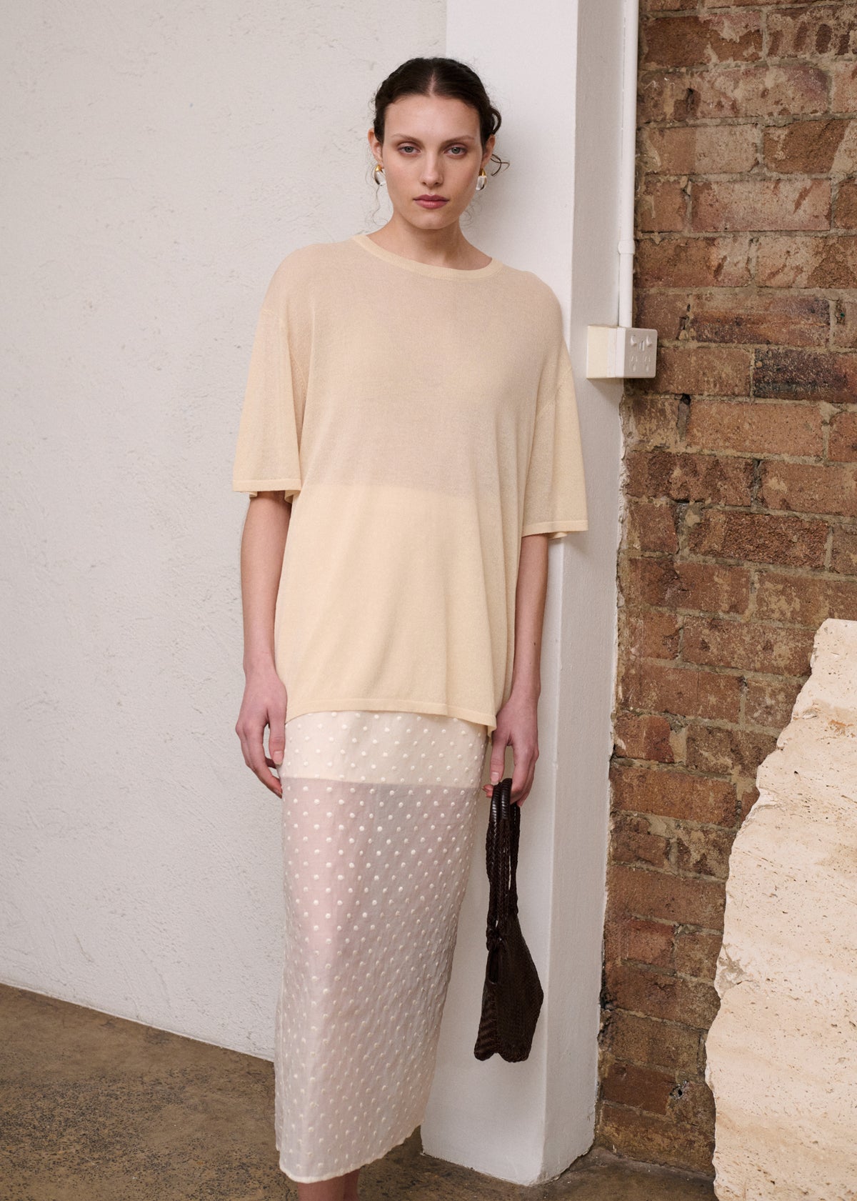Model wearing Cream Embroidered Spot Sheer Layered Midi Skirt, showing a sheer layered finish and a midi length.