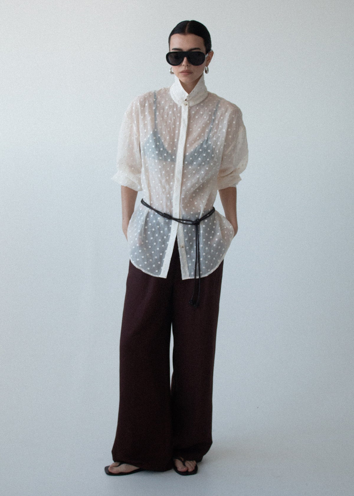 Model wearing Cream Embroidered Spot Sheer Oversized Shirt with a subtle spot texture and a classic collar.