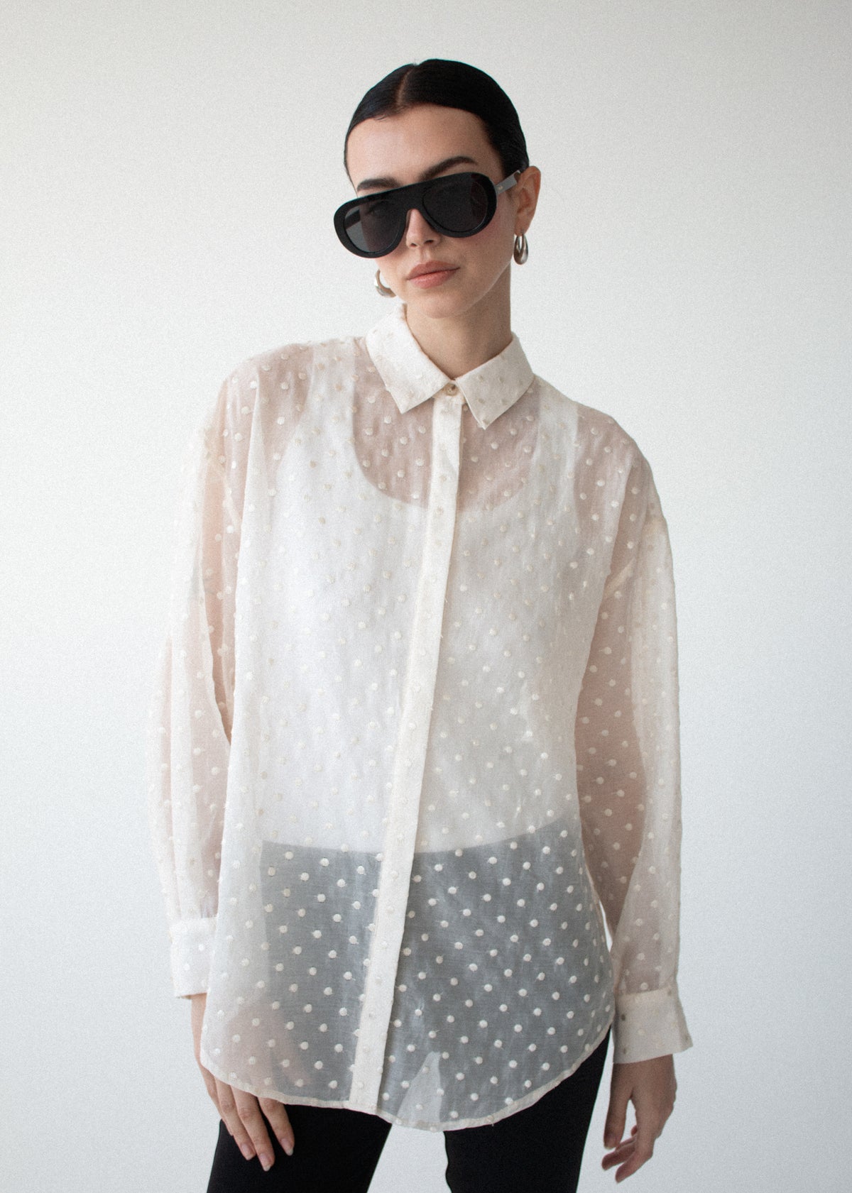 Close-up of the Cream Embroidered Spot Sheer Oversized Shirt, showing a classic collar and a button-through front.