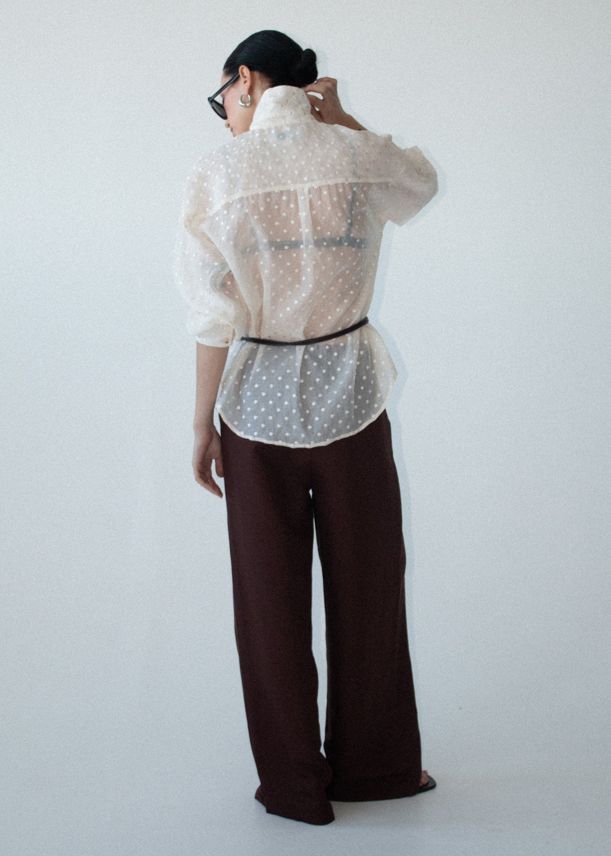 Back view of the Cream Embroidered Spot Sheer Oversized Shirt with a button-through front and long sleeves with button cuffs.