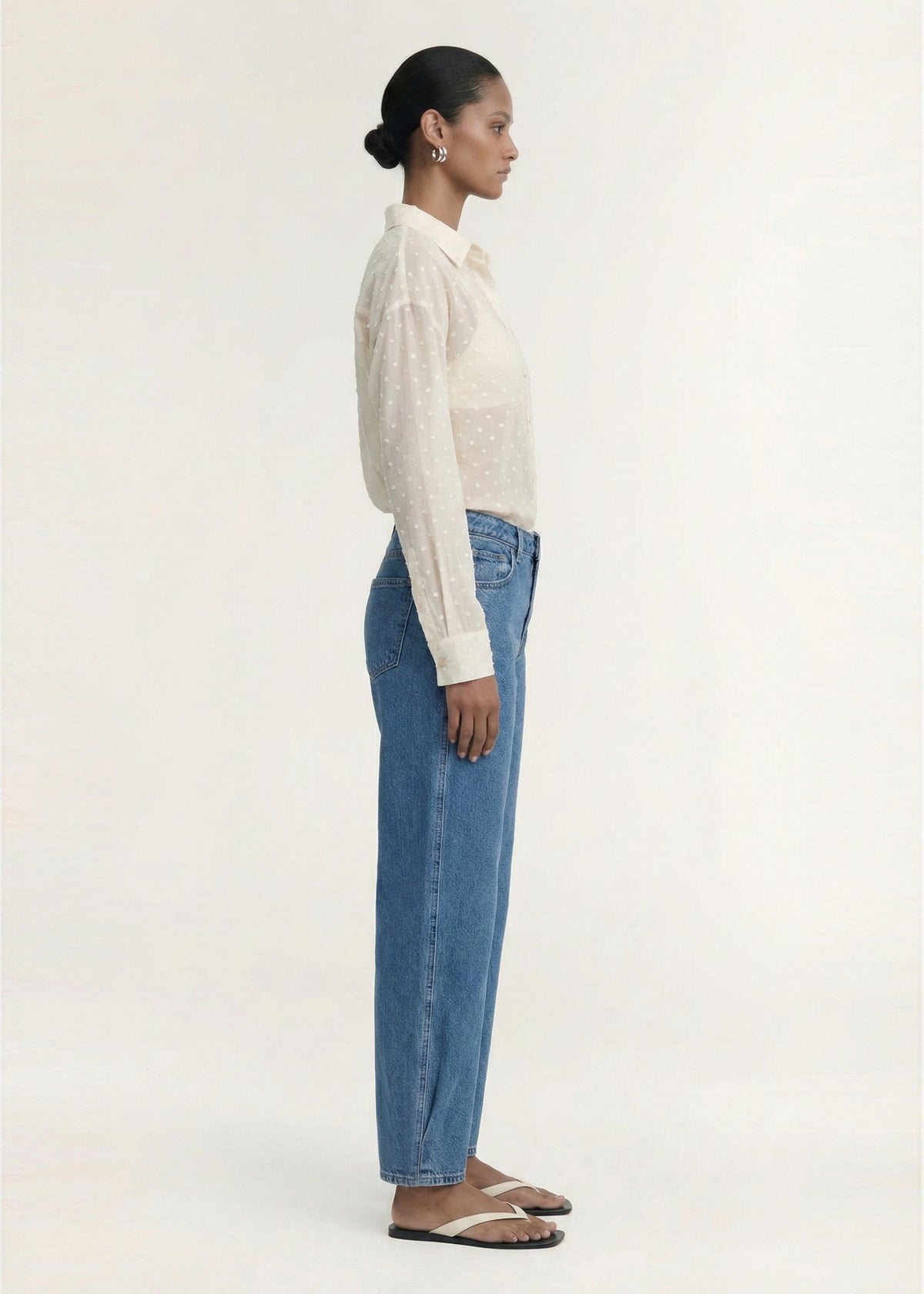 Side profile of the Cream Embroidered Spot Sheer Oversized Shirt with a classic collar and a button-through front.