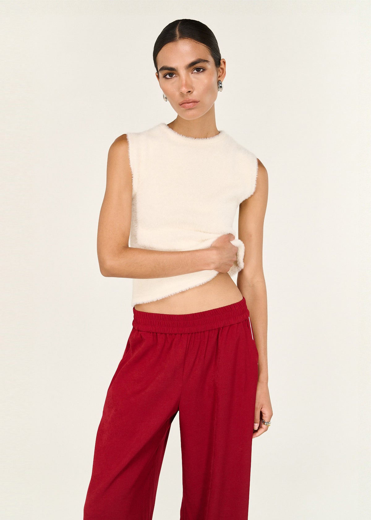Close-up of the Cream Fluffy Knit Tank, showing a sleeveless silhouette and a crew neckline.