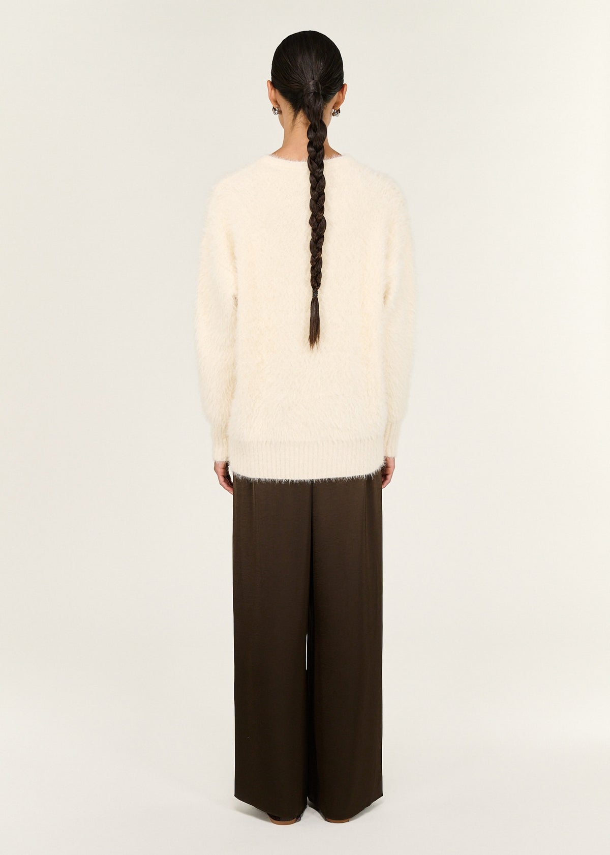 Back view of the Cream Fluffy Oversized Jumper with an oversized silhouette and a soft fluffy knit fabrication.