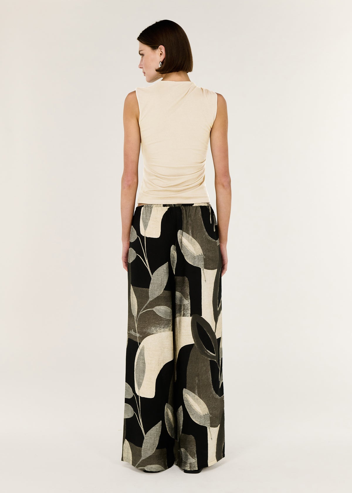 Side view of the Cream Ruched Slinky Tank, showing a colour: Stone and a sleeveless silhouette.