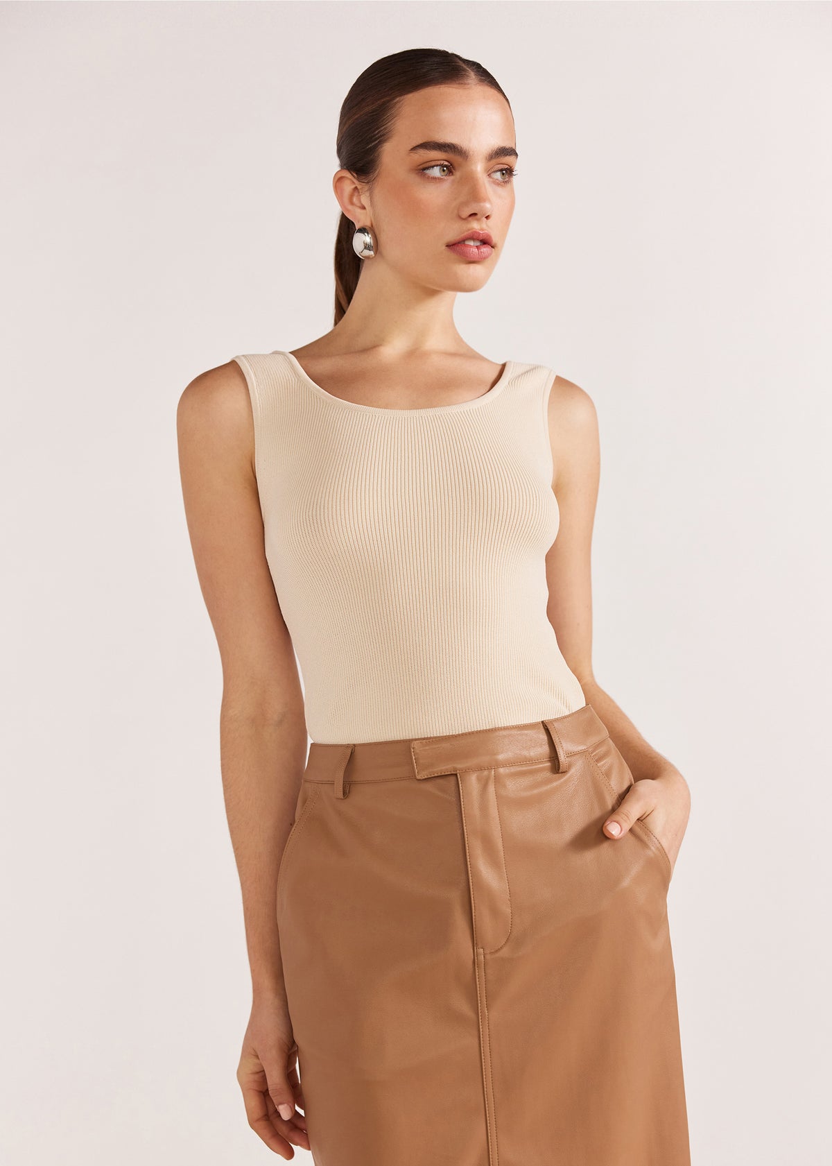 Close-up of the Cynthia Pu Midi Skirt, showing a soft PU fabric and a back vent.