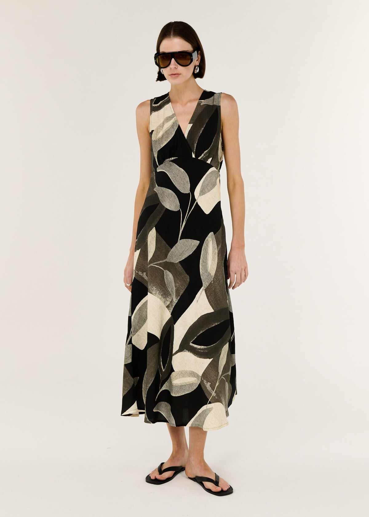 Model wearing Dark Leaf Bias Midi Dress with a bias-cut silhouette and a soft V-neckline.